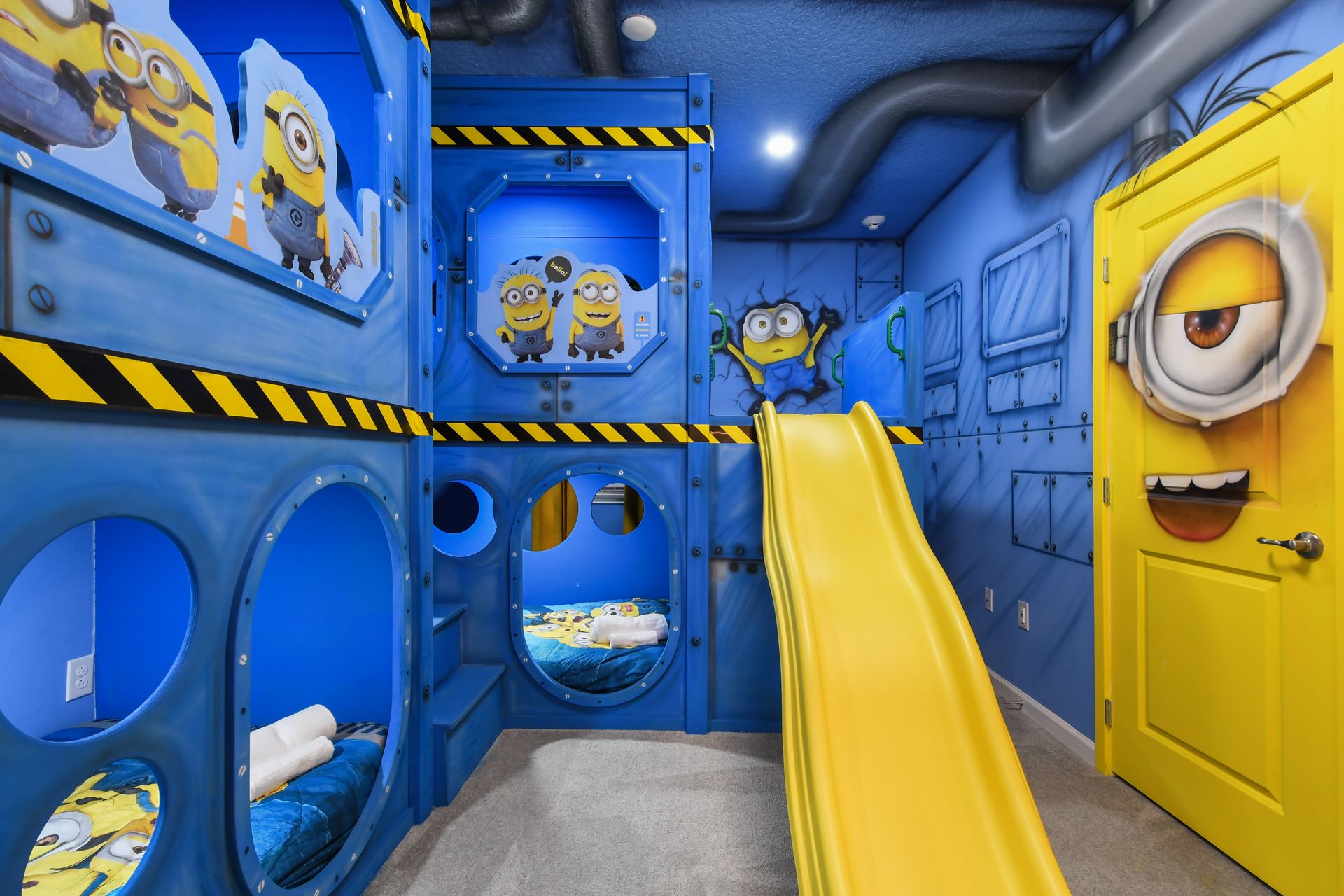 Minion-themed bunk room with slide, tunnels, and fun-filled adventure vibes
