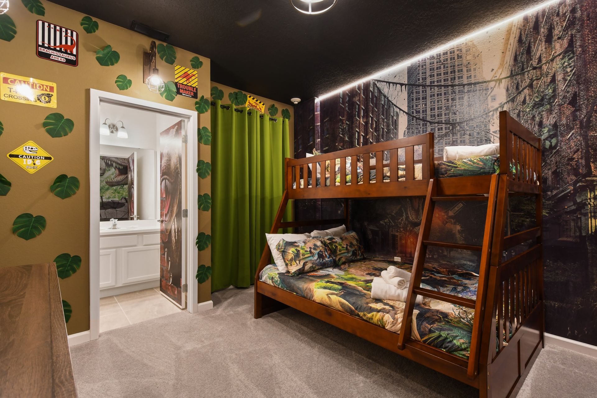 Dino adventure bunk room with jungle décor, city ruins, and themed bedding
