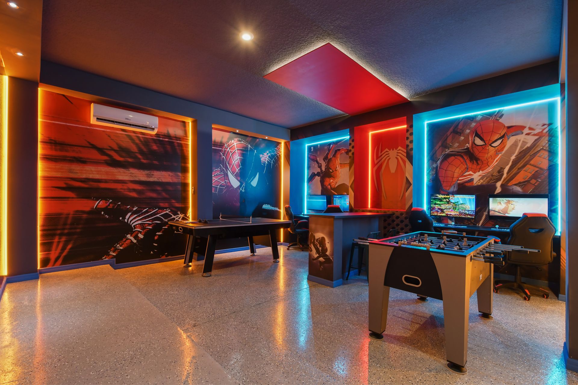 Action-packed Spider-Man game room with air hockey, foosball, and dual gaming stations
