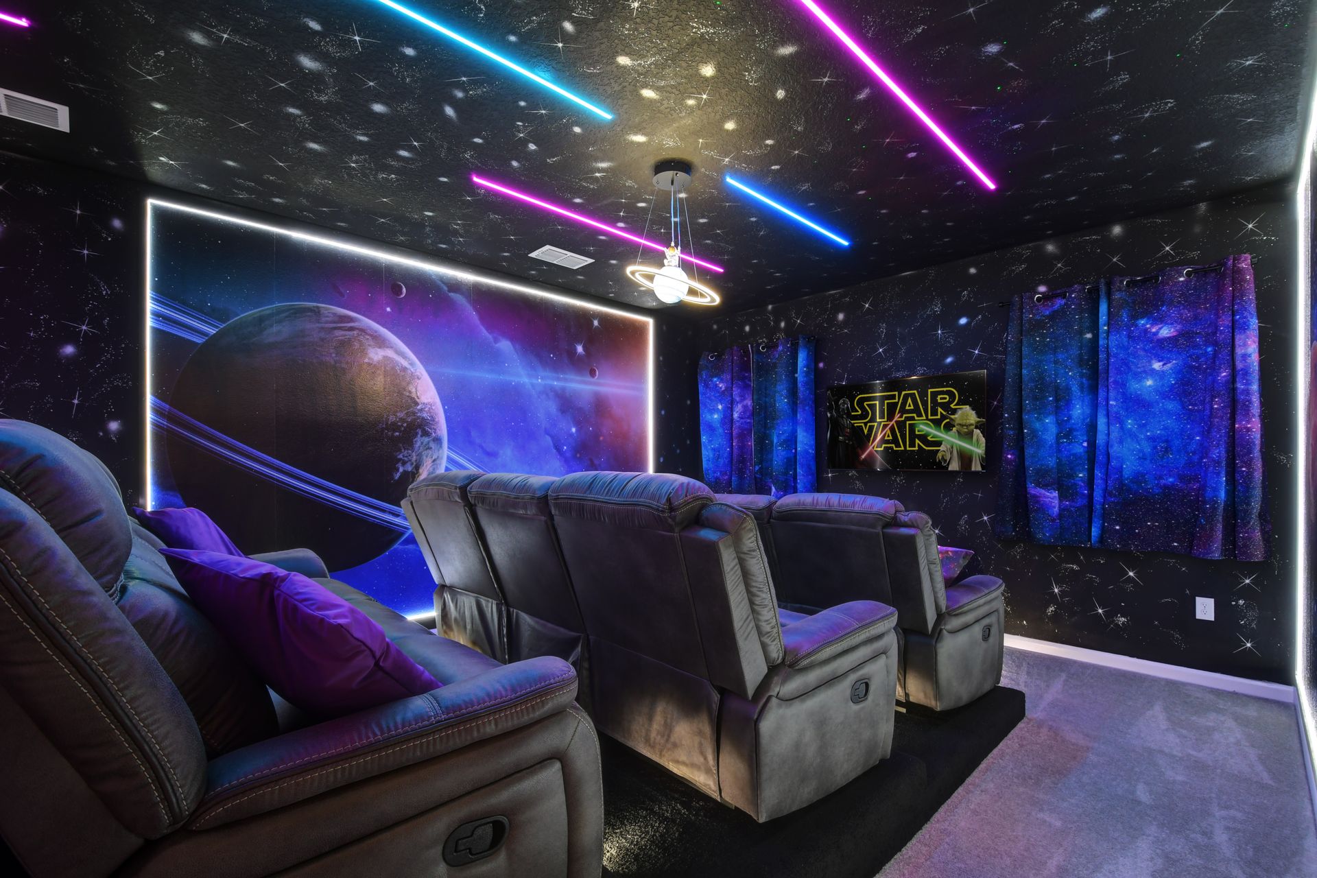 Galaxy-themed home theater with LED lights and recliners—immerse in epic movie nights!
