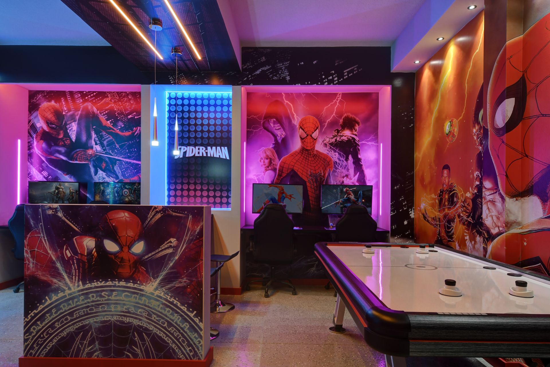 Epic game room with Spiderman murals, neon lighting, and arcade-style fun.