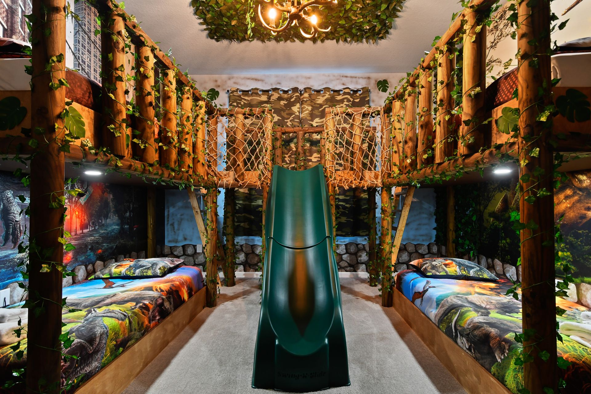 Jungle-themed room with bunk beds, slide, and green lighting—wild adventure awaits