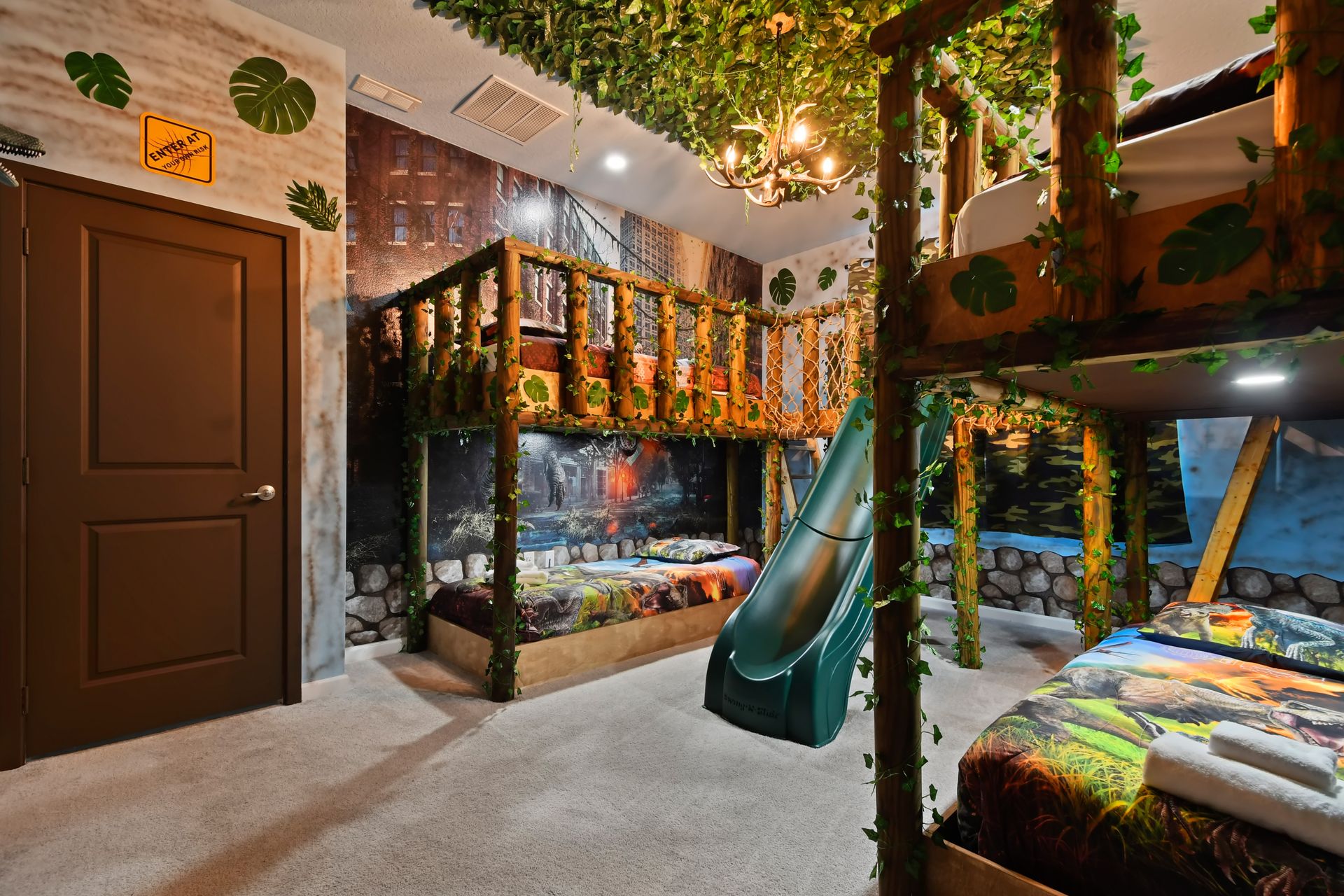 Jungle-themed room with bunk beds, slide, and green lighting—wild adventure awaits