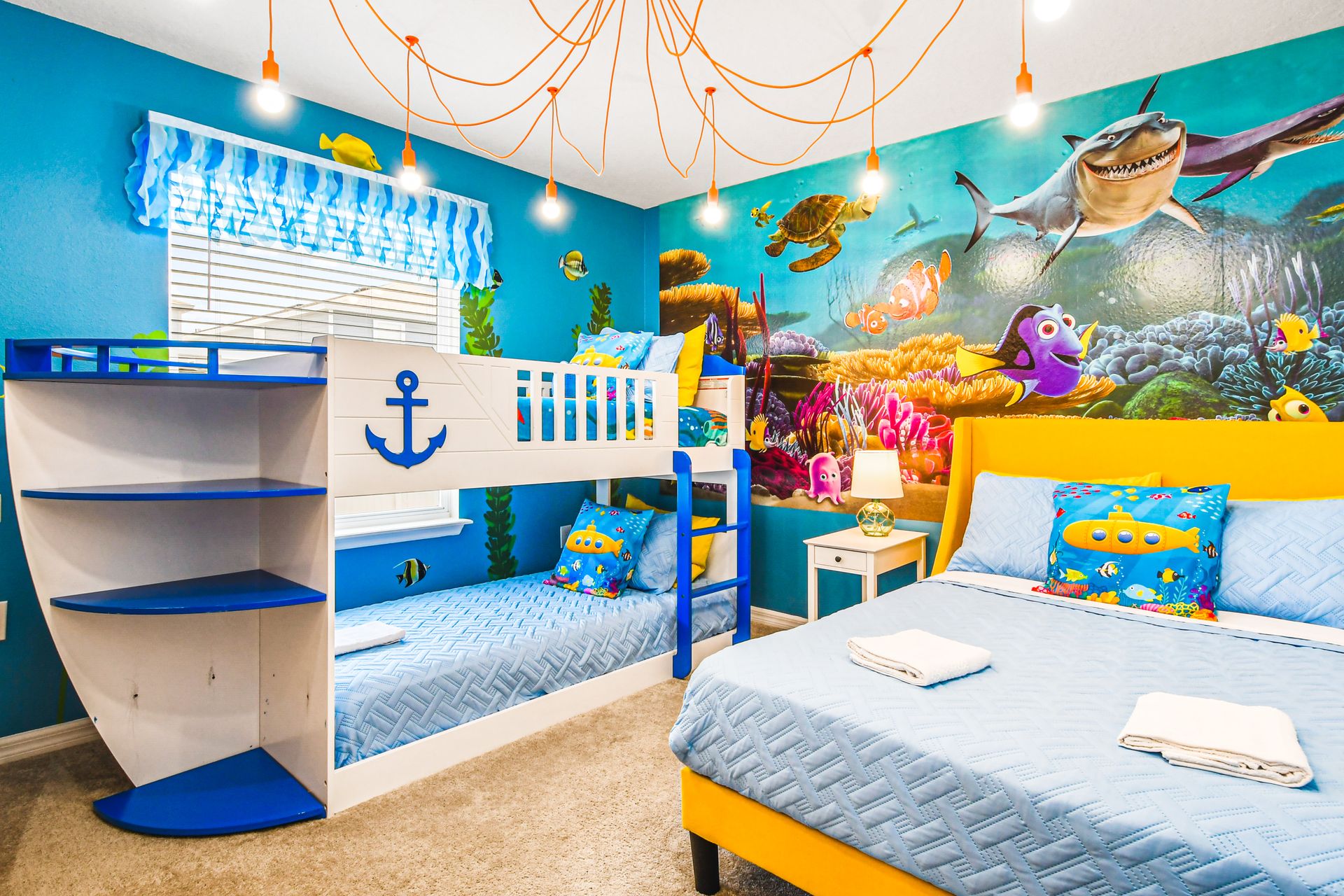 Underwater-themed kids' room with vibrant decor and bunk beds