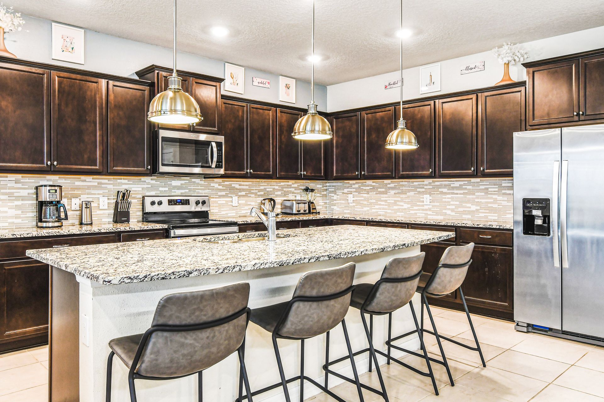 Modern kitchen with granite counters and bar seating