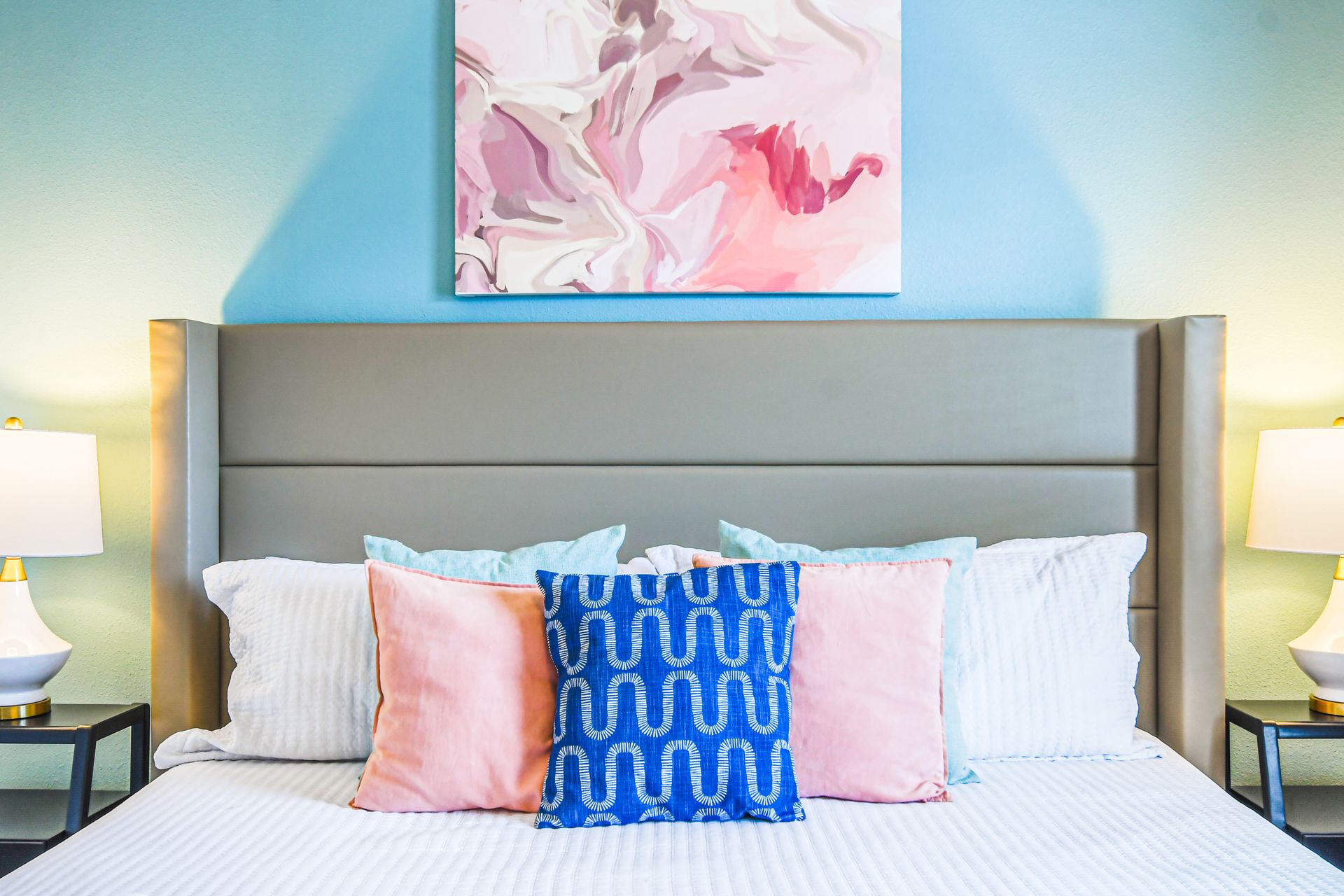 Chic bedroom with soft pastels, modern accents, and cozy vibes.