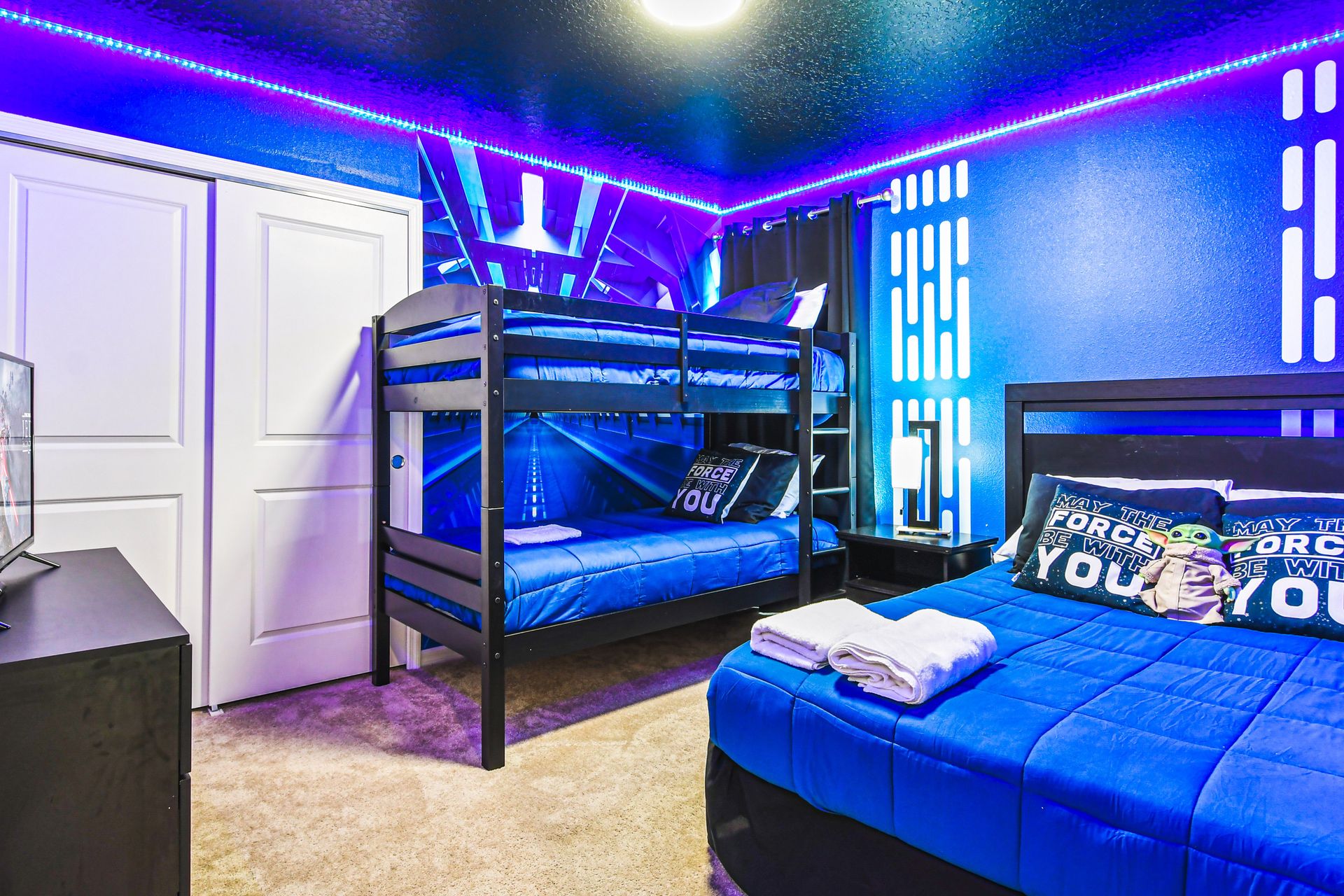 Epic galaxy-themed room with bunk beds and glowing LED lights