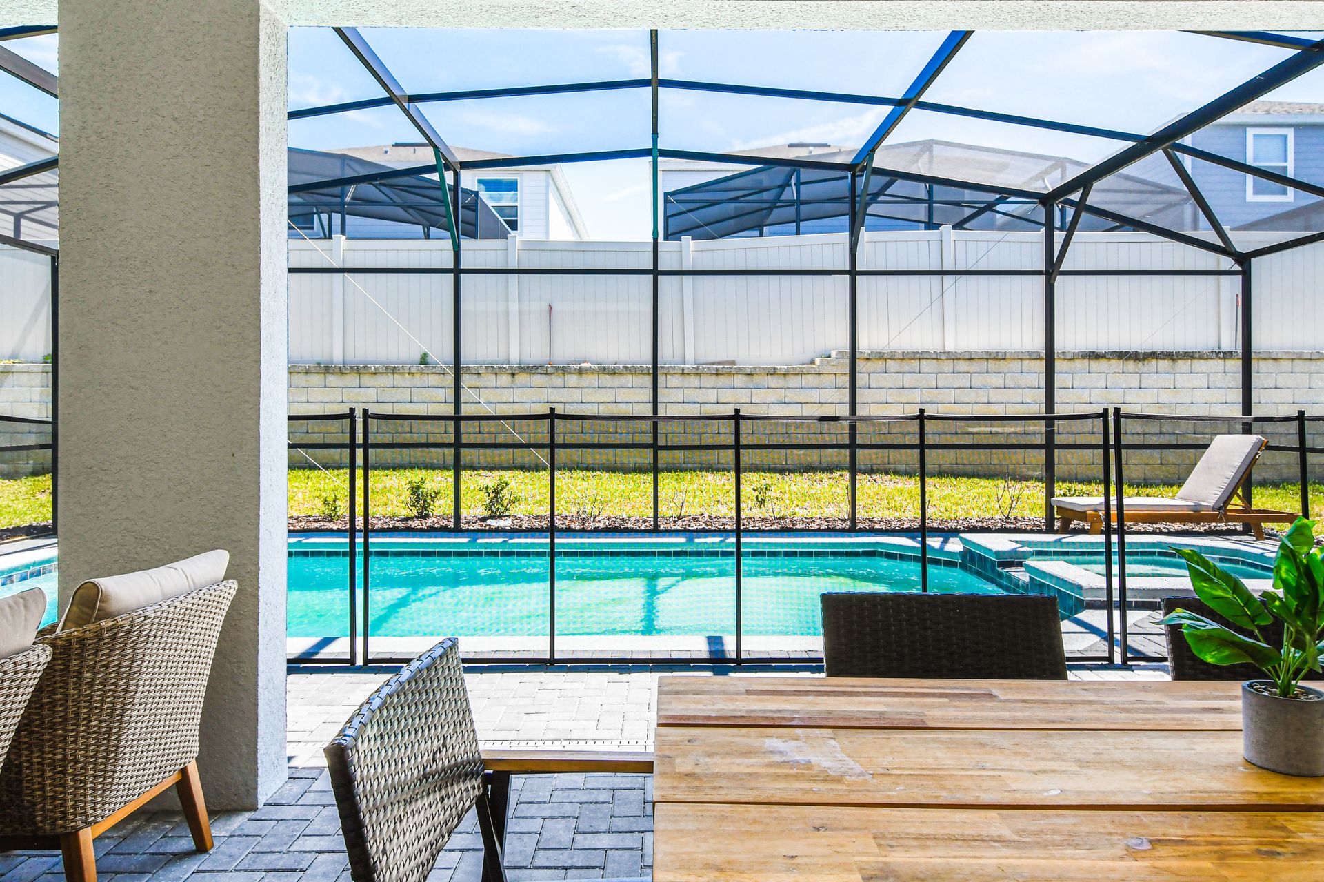 Relax by the private screened pool and spa with outdoor dining.
