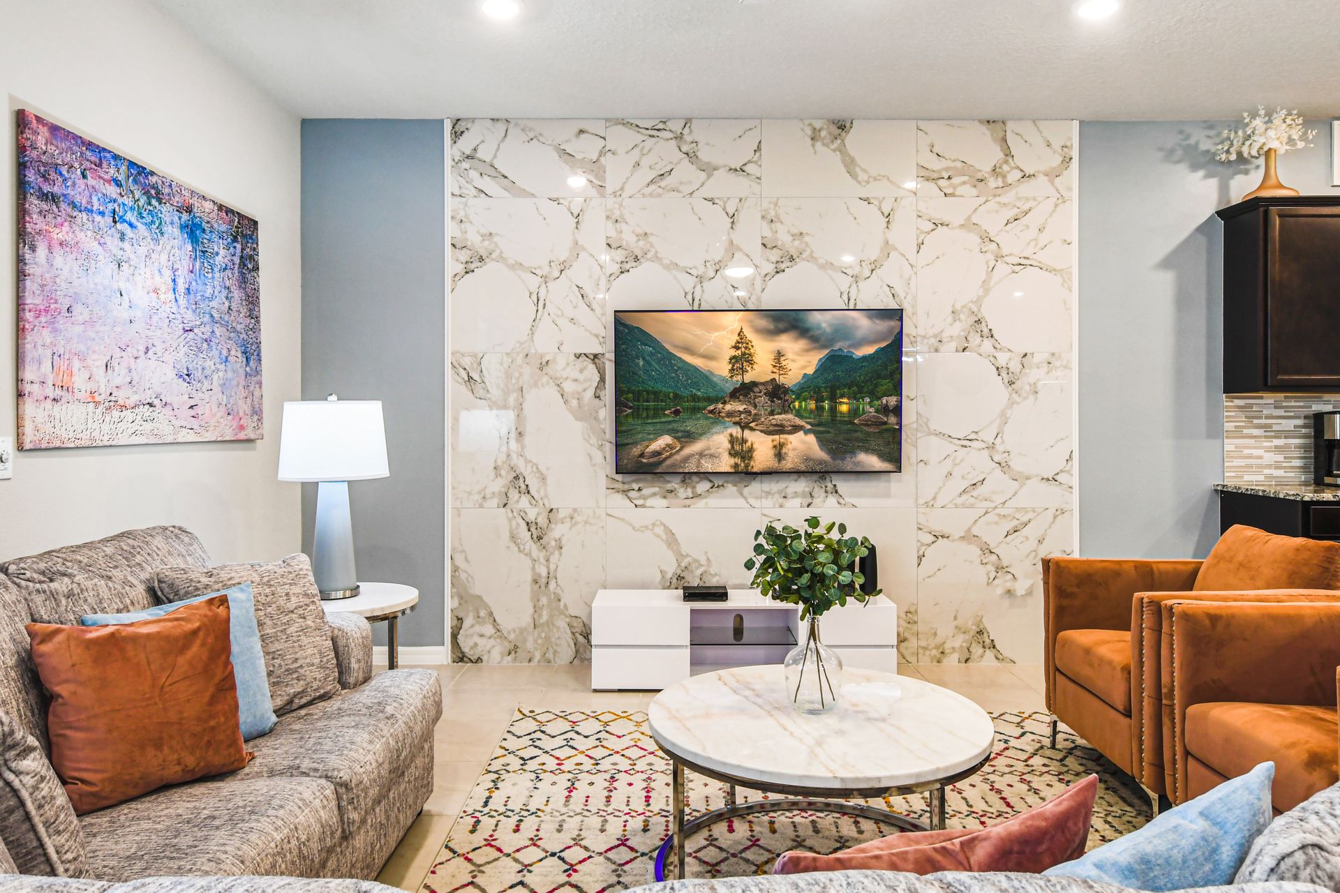 Elegant living area with marble accents and vibrant modern decor