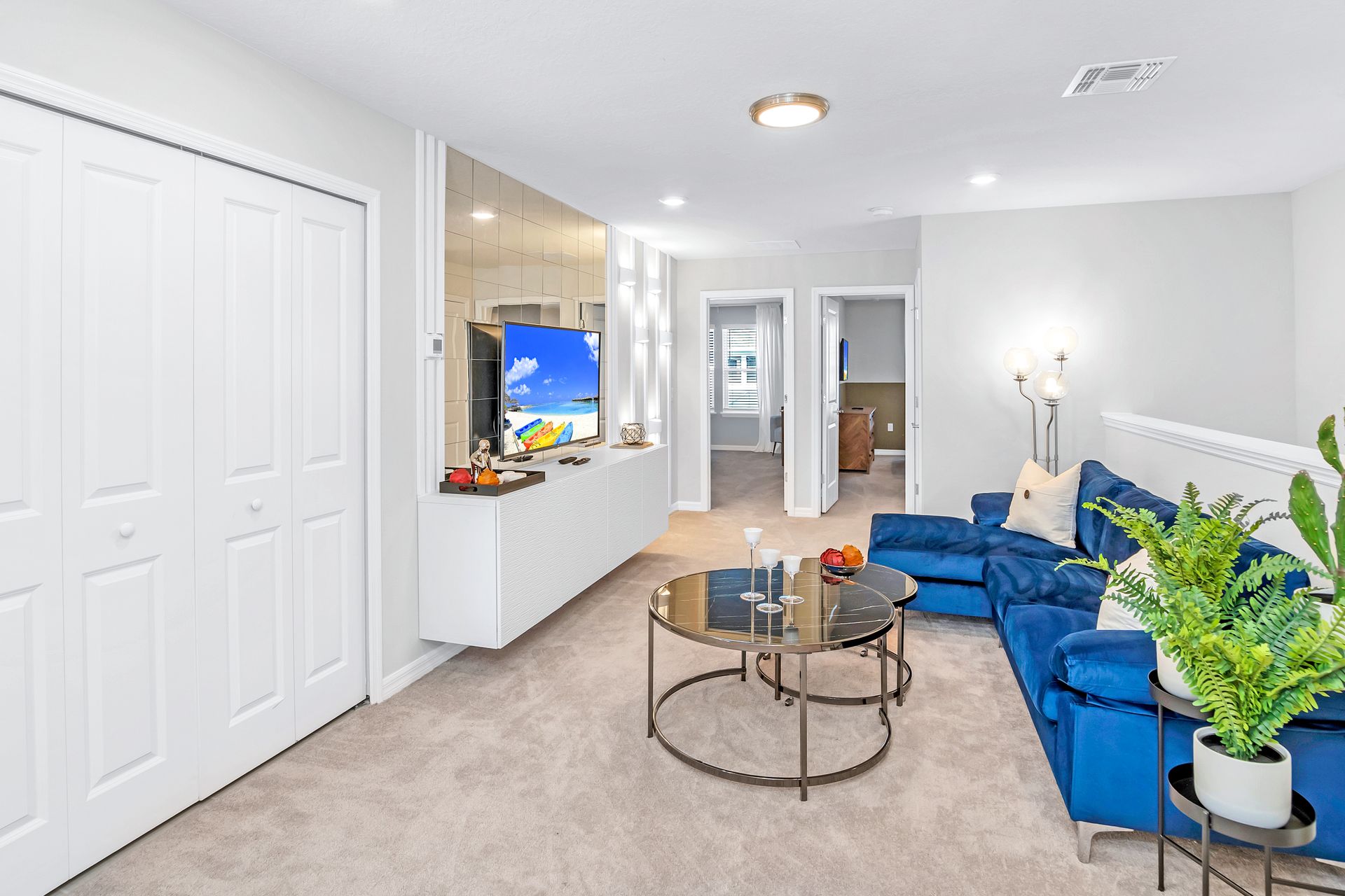 Enjoy quality time with loved ones in our inviting living room, offering a cozy space for relaxation.