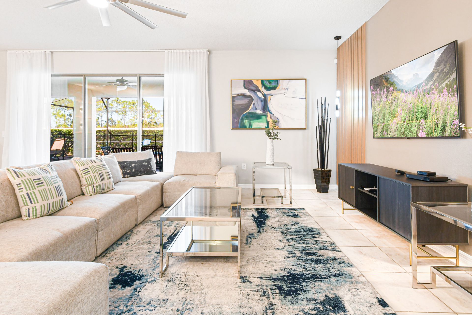 Spacious living room area with cozy soft sofa, perfect for a family reunion.