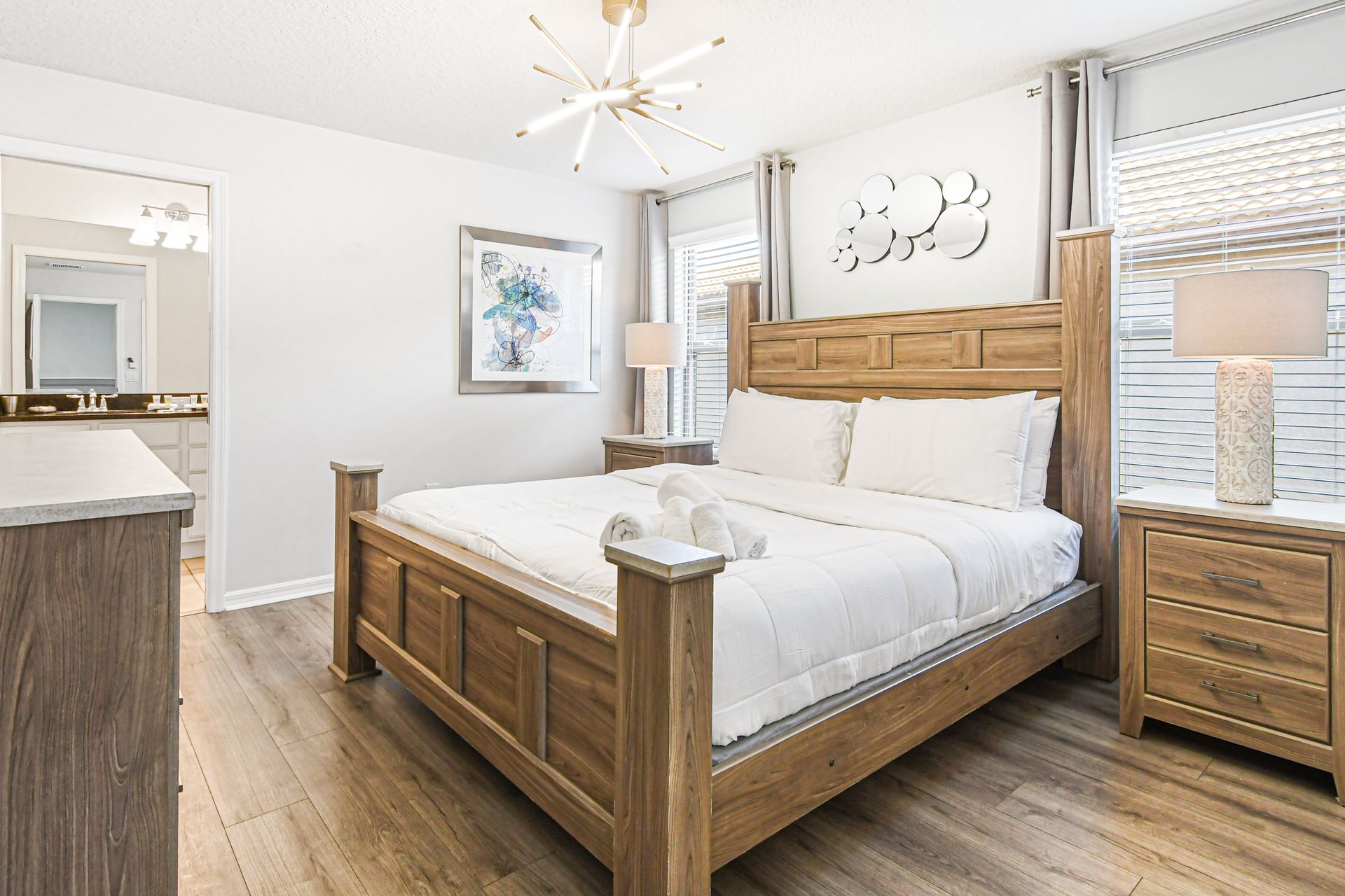 Bright, modern bedroom with cozy king bed, ensuite bath, and stylish decor.