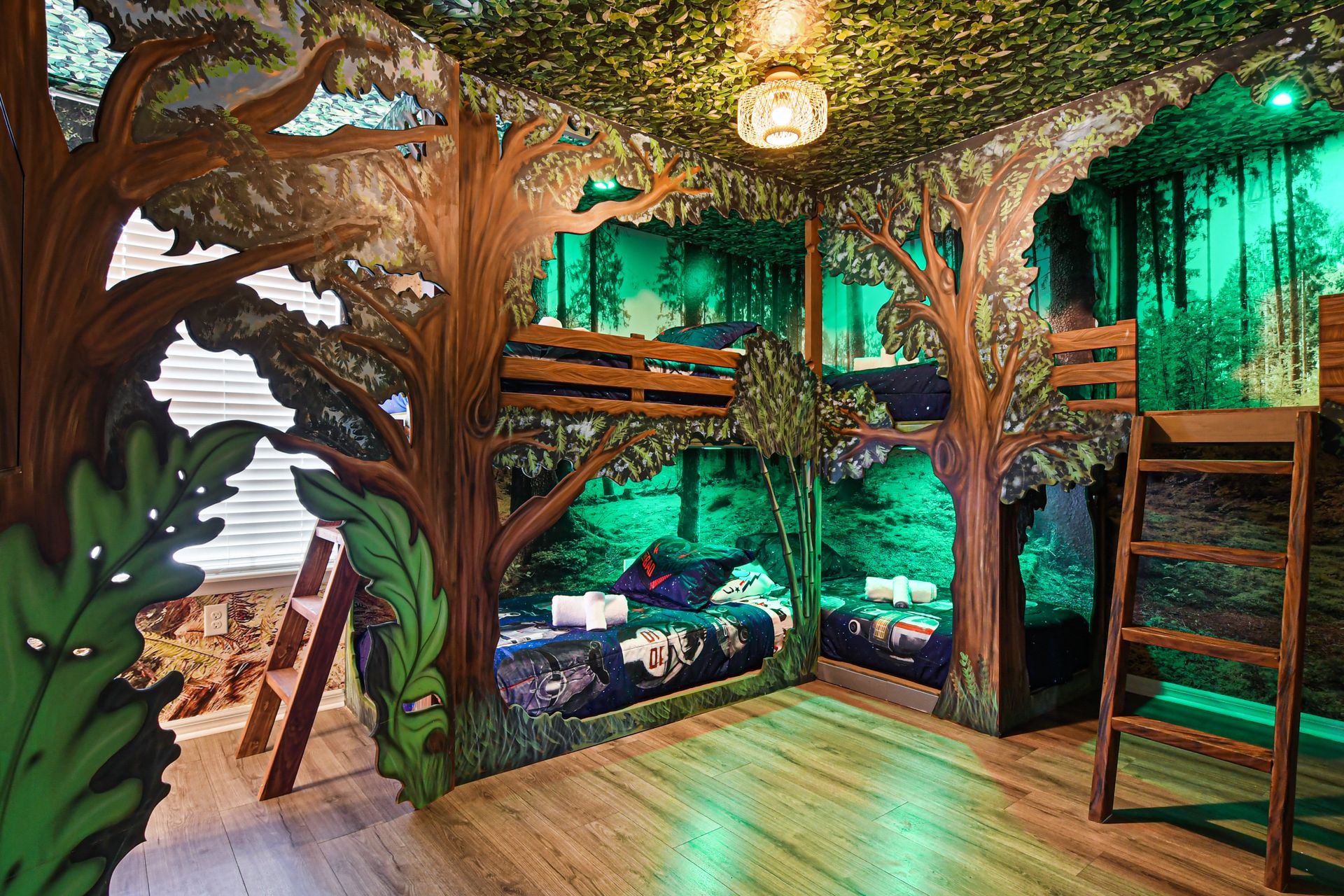Magical forest bunk room with custom tree beds, glowing lights, and adventure feel.
