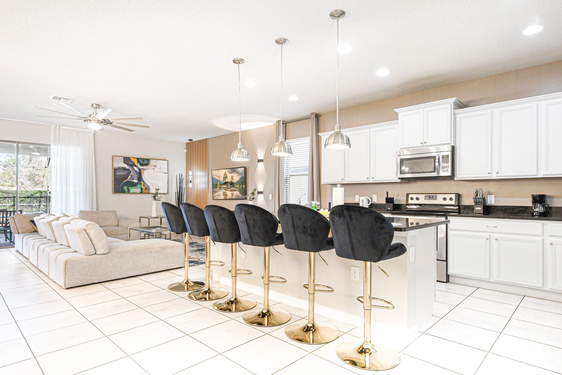 Bright open kitchen with sleek bar seating, perfect for gathering and entertaining.