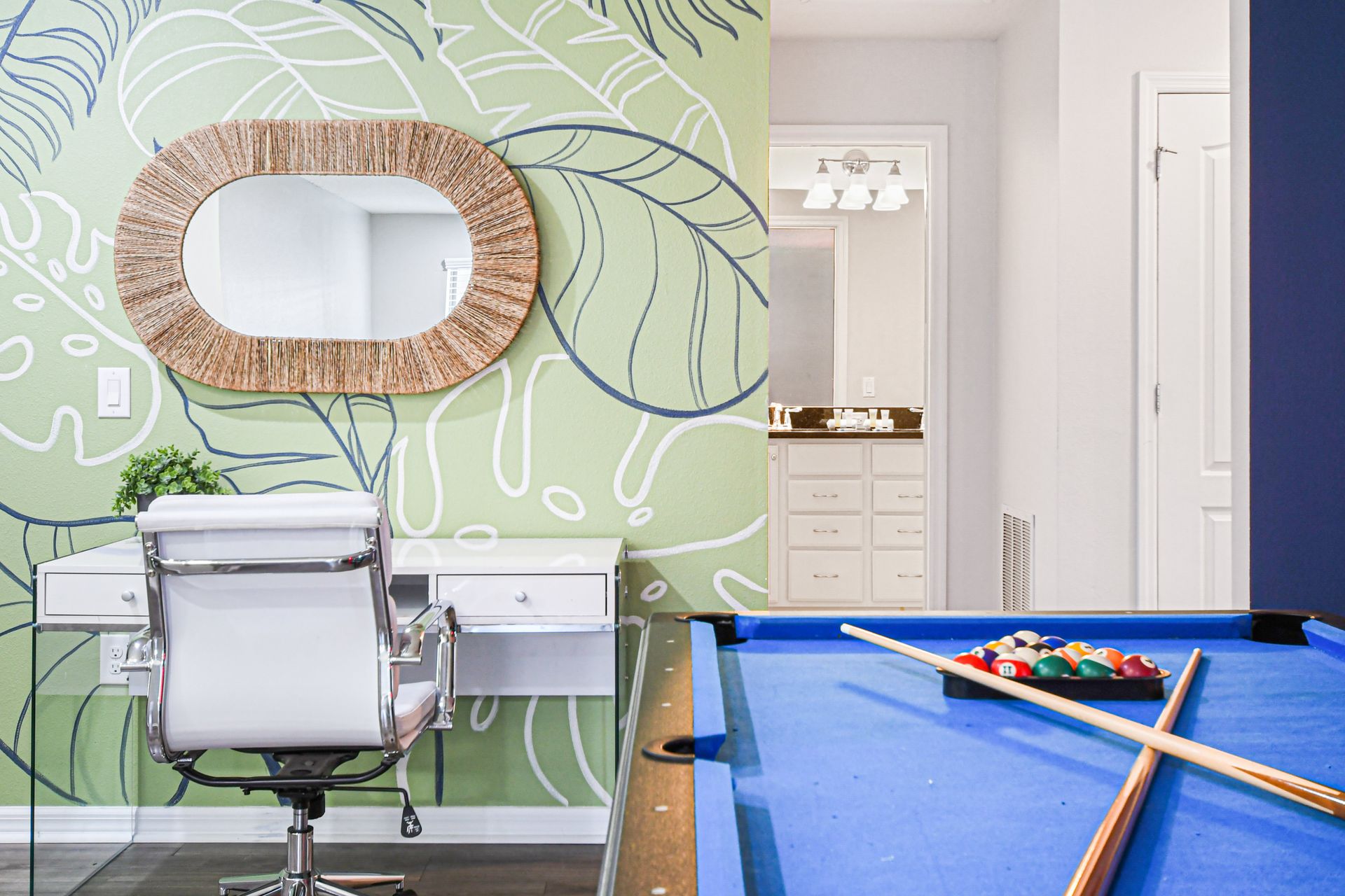 Tropical workspace and pool table in a vibrant, stylish and fun-filled loft area.