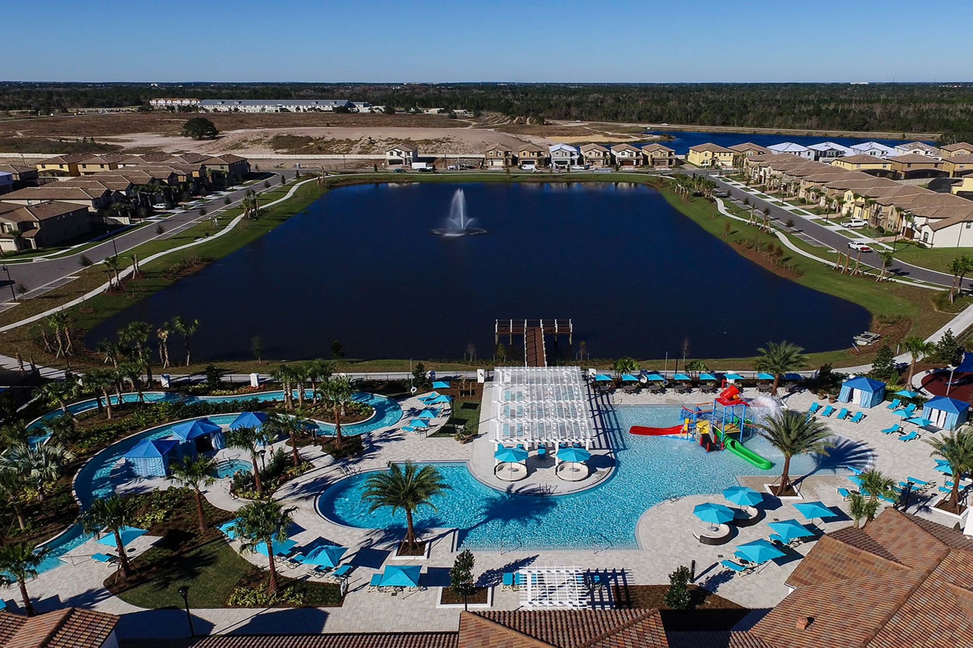 Aerial view of luxury resort amenities: pools, lazy river, splash park, and sports courts!