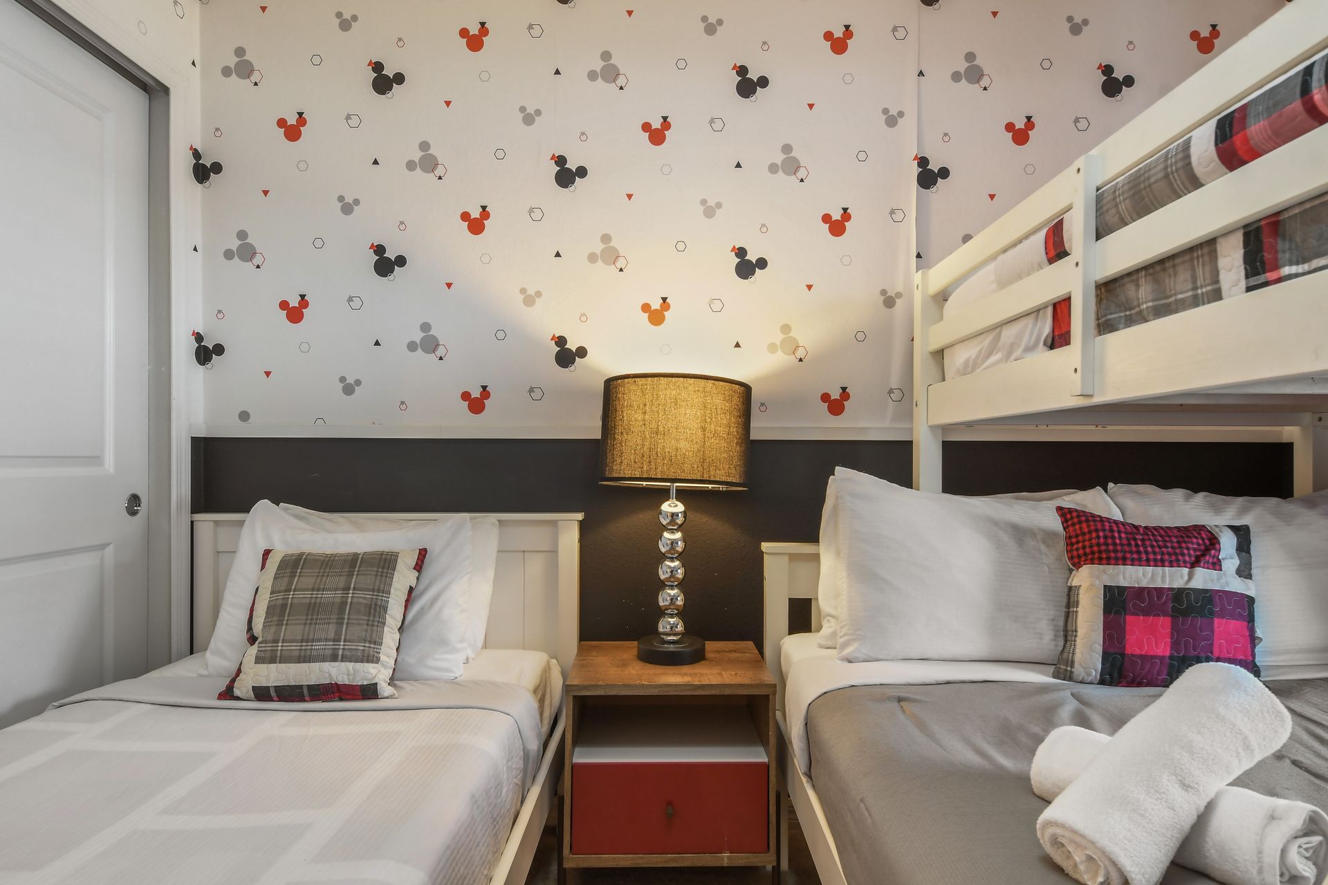 Whimsical Disney-themed room with cozy beds, playful decor, and a magical touch.