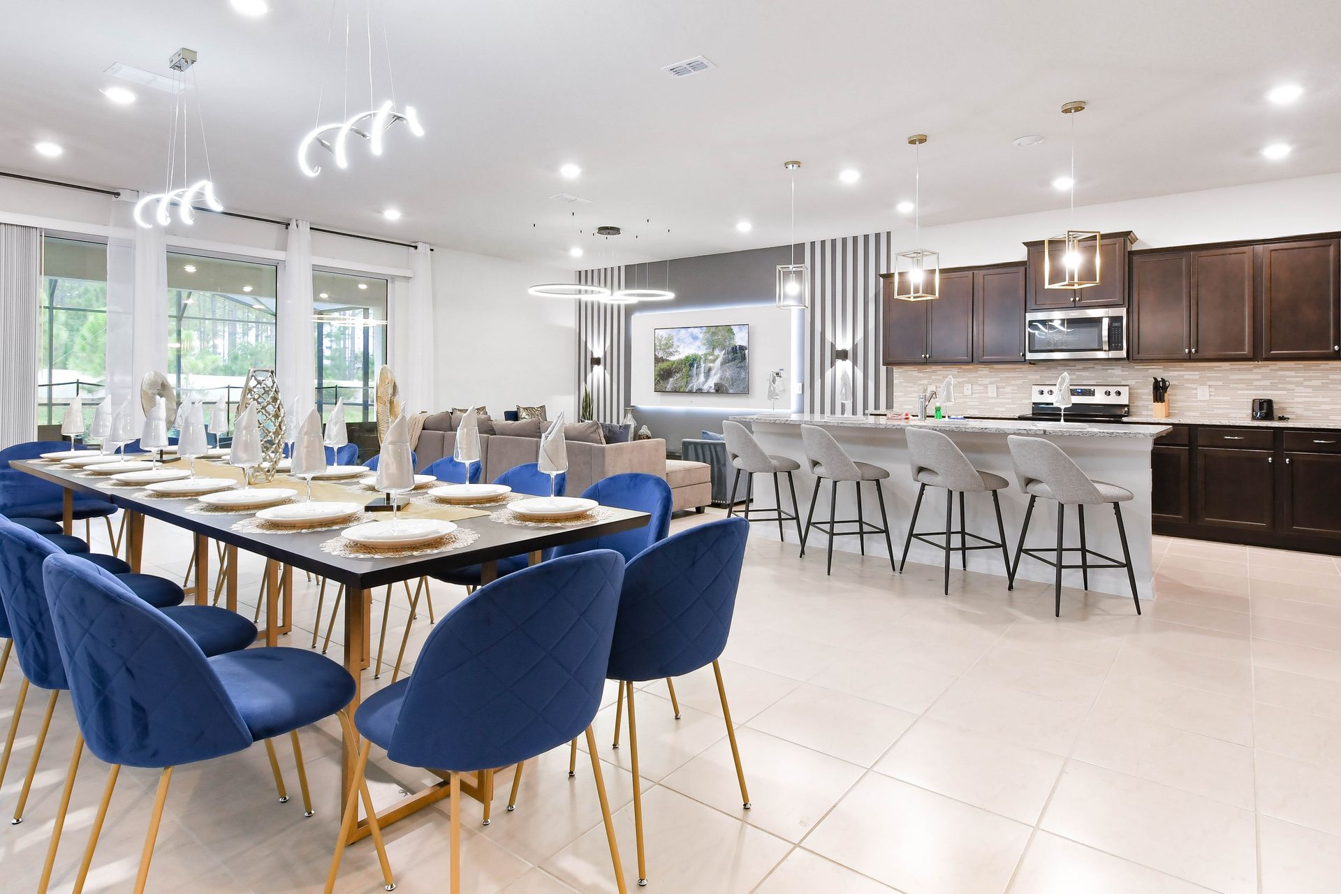 Elegant open-concept kitchen and dining area with seating for large groups.