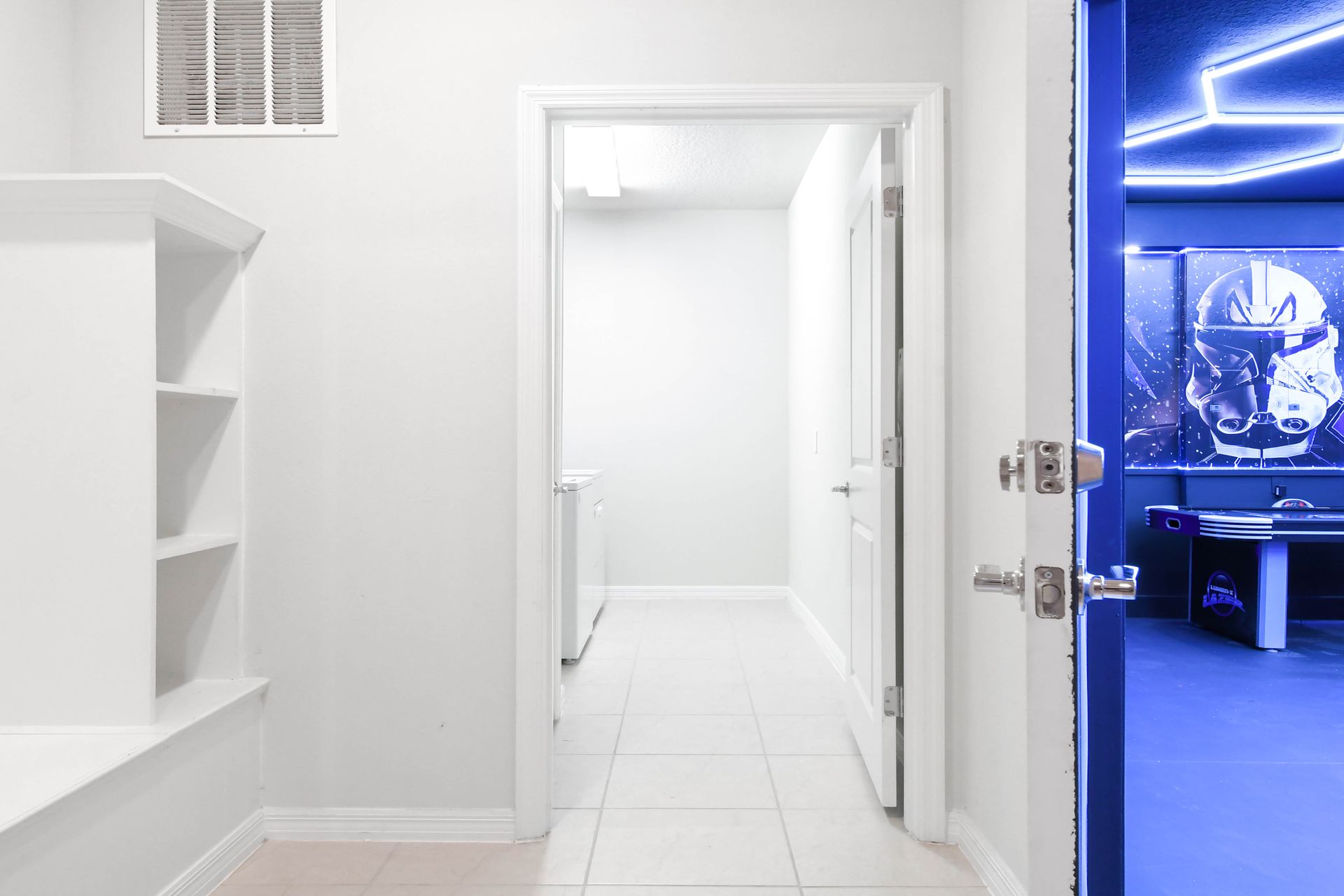 Step from a bright hallway into an epic galaxy-themed game room full of adventure.