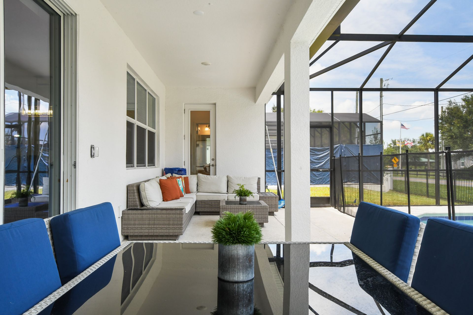 Relax in style on the covered patio with cozy seating and poolside dining!