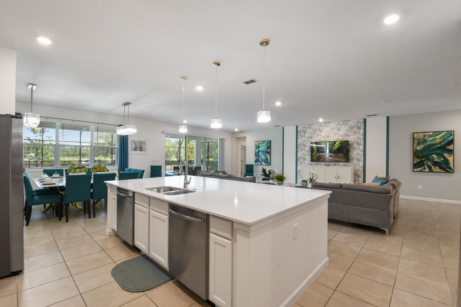 Modern open-concept kitchen with a spacious island, elegant lighting, and cozy vibes!