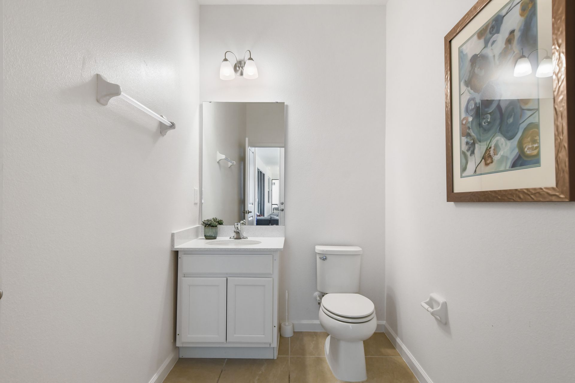 Bright and stylish half-bath with modern decor, perfect for a refreshing retreat!