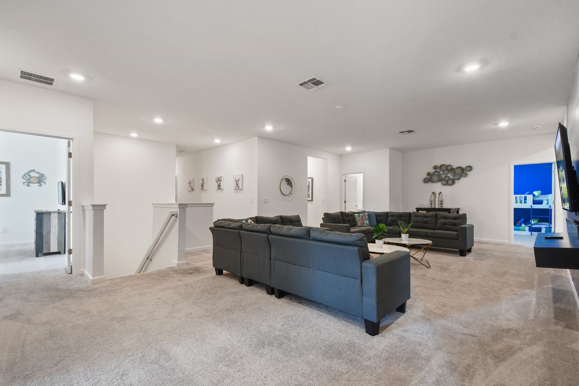 Spacious upstairs loft with plush seating, modern décor, and a perfect entertainment spot!