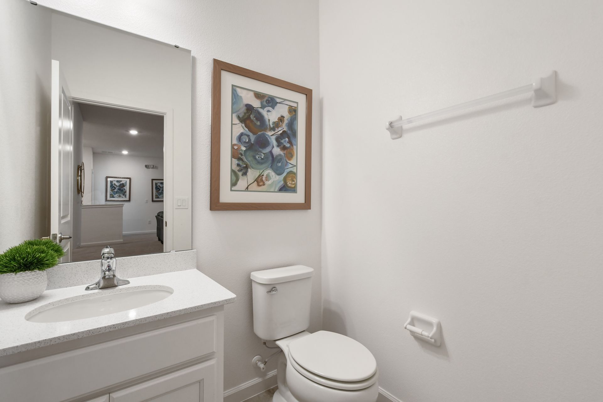 Bright coastal-themed bathroom with a tub, perfect for a relaxing getaway!