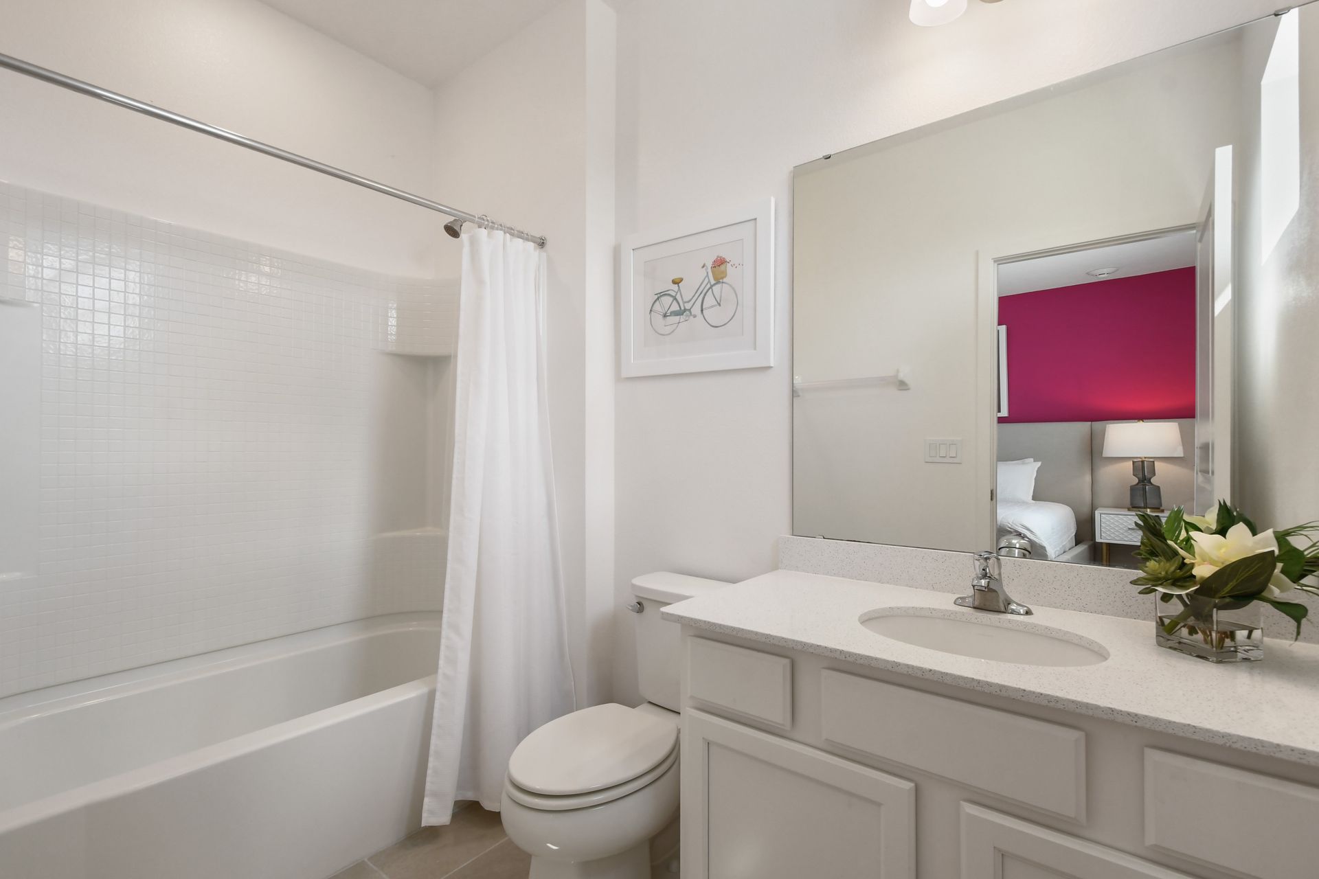 Bright coastal-themed bathroom with a tub, perfect for a relaxing getaway!