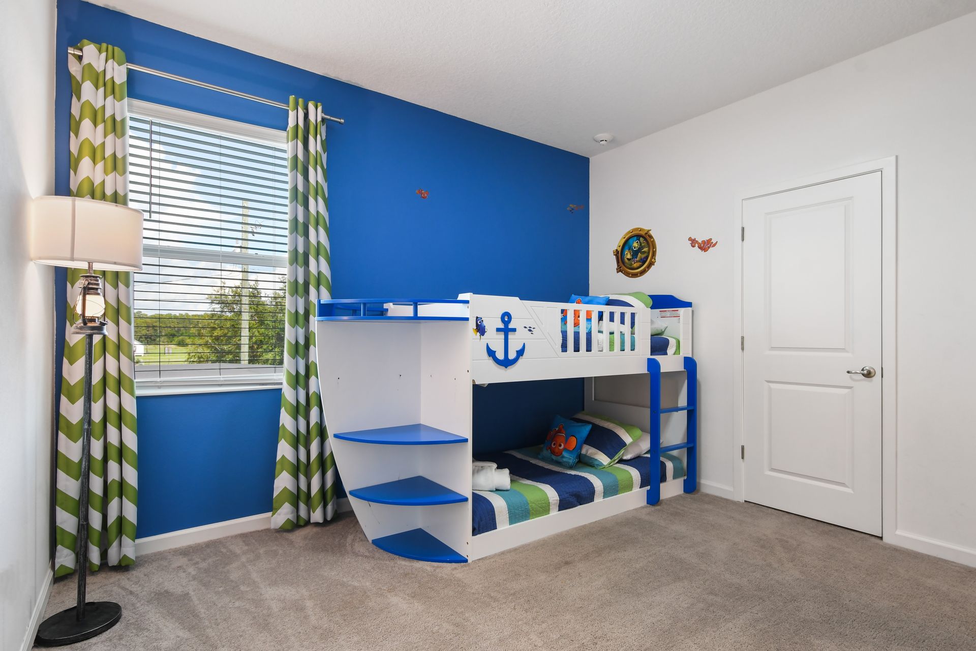Nautical-themed kids' room with a fun boat bunk bed—perfect for little adventurers! 