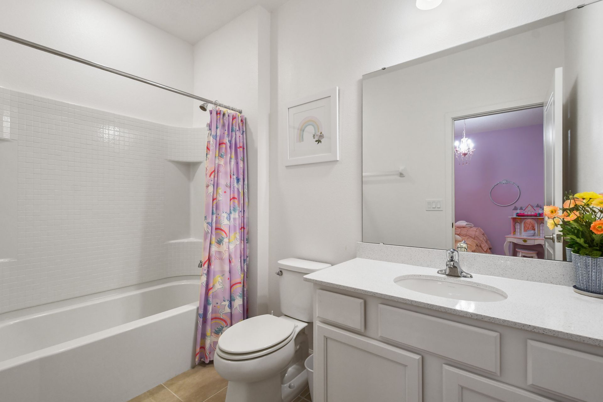 Bright coastal-themed bathroom with a tub, perfect for a relaxing getaway!