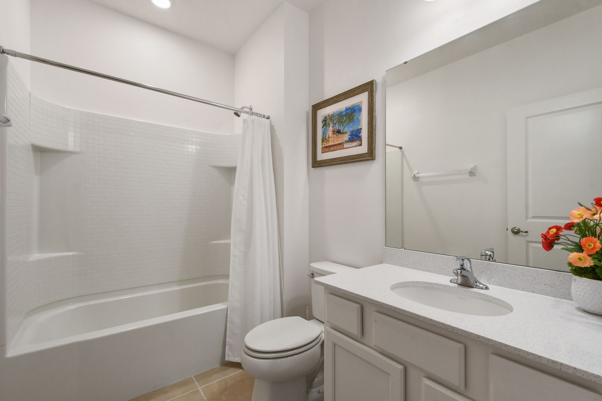 Bright coastal-themed bathroom with a tub, perfect for a relaxing getaway!
