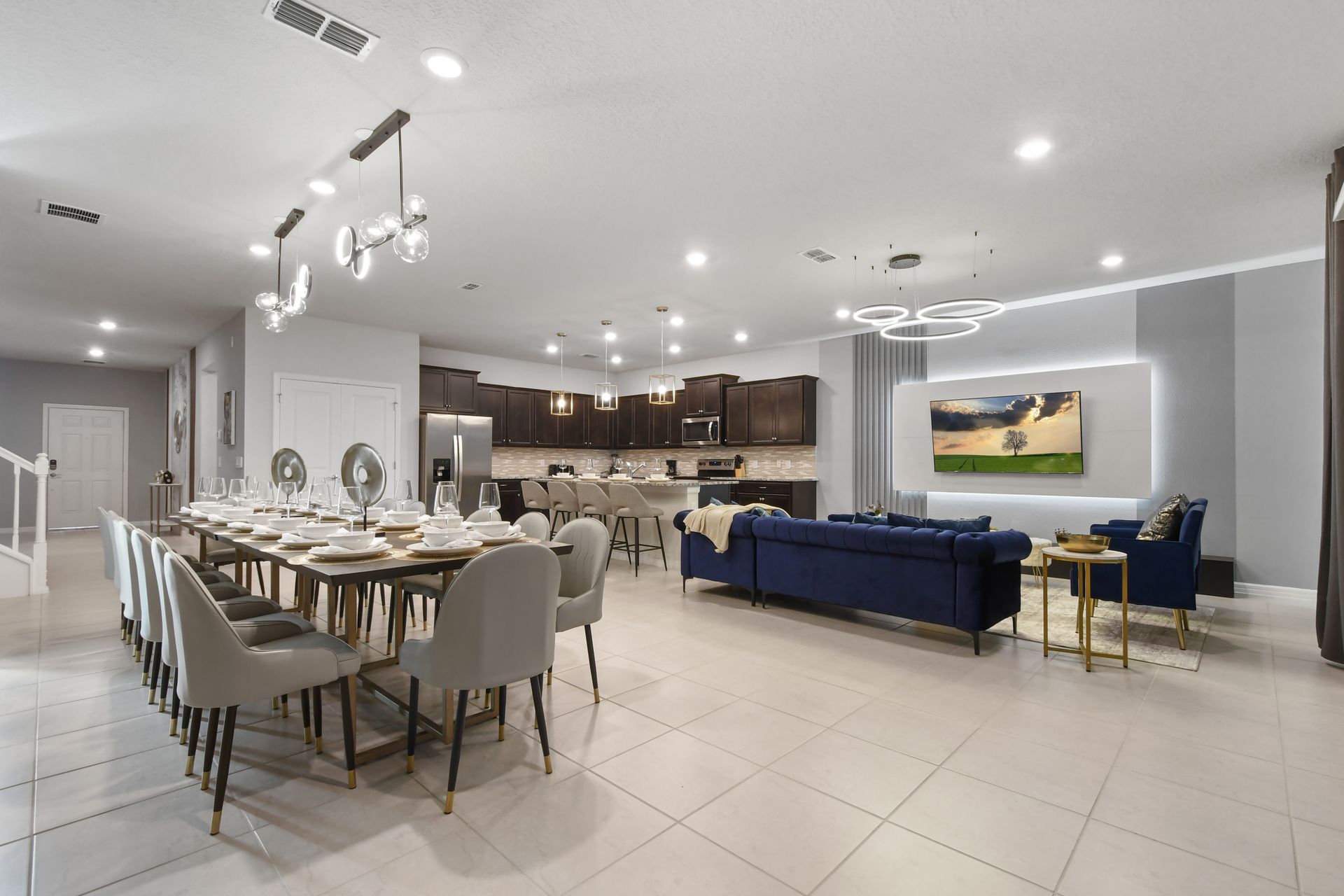 Spacious open layout with upscale dining, sleek kitchen, and cozy lounge area.