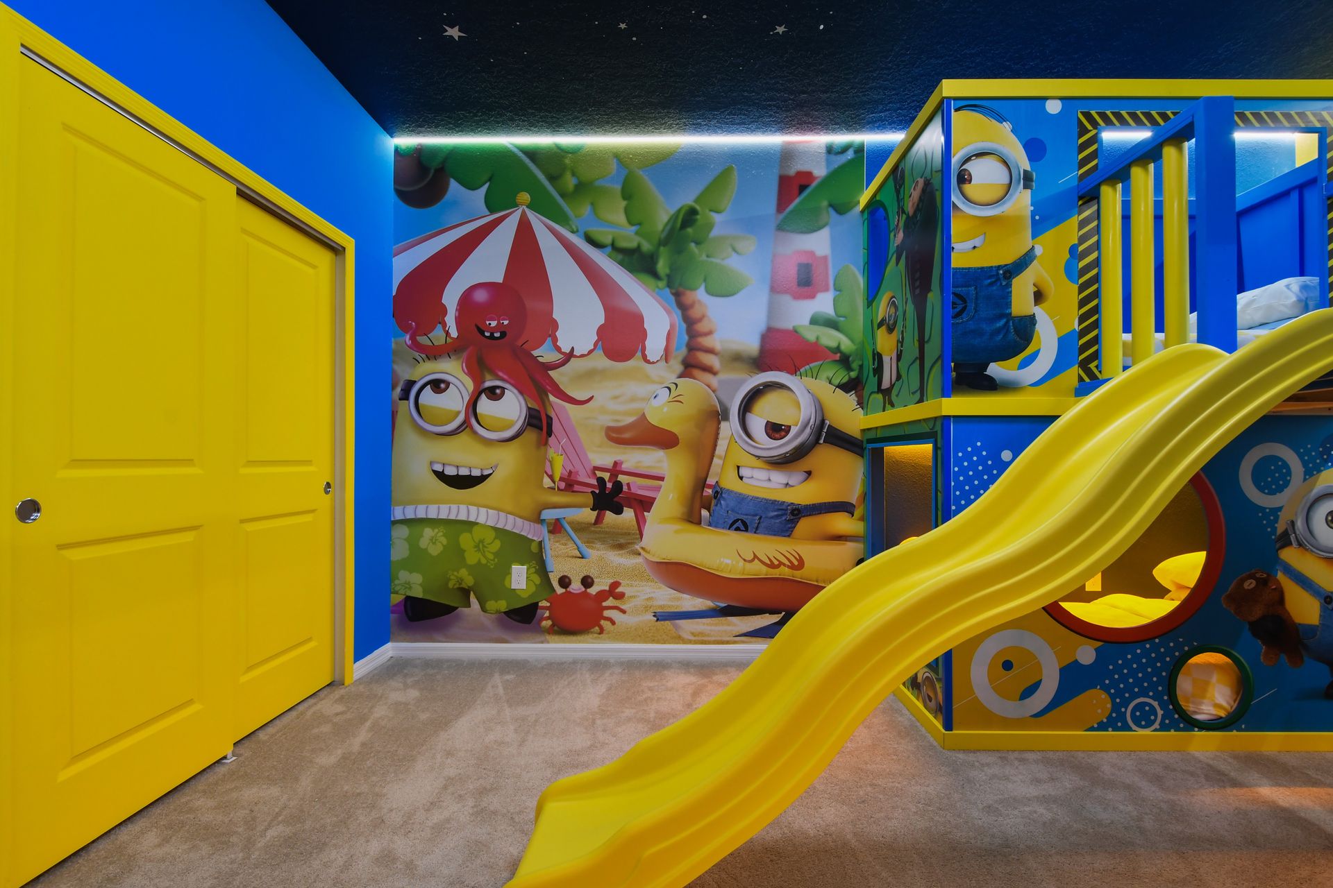 Epic Minion bunk room with slide, themed beds, and immersive wall art.