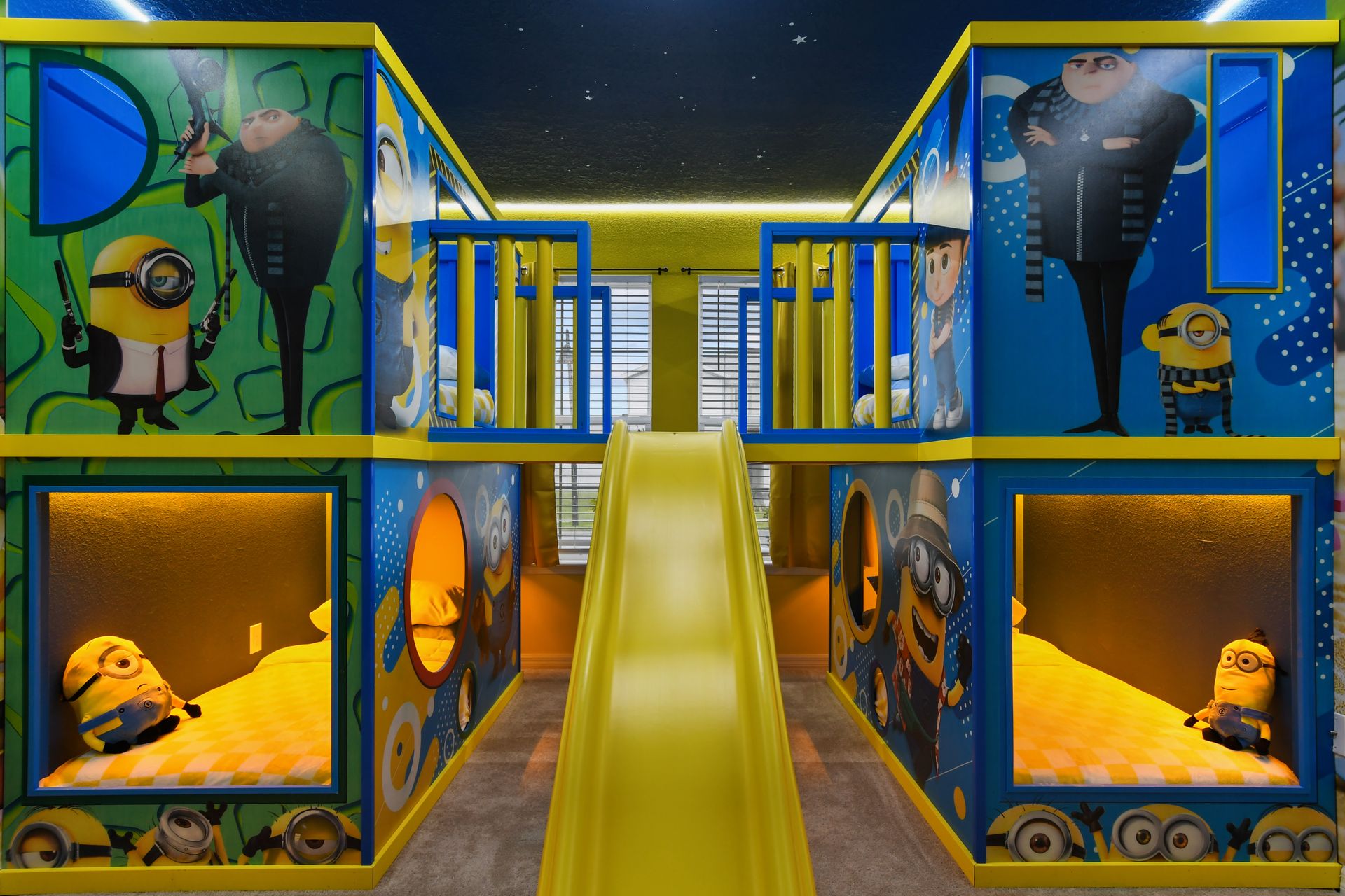 Minion-themed bunk room with slide, murals, and built-in beds for nonstop fun.