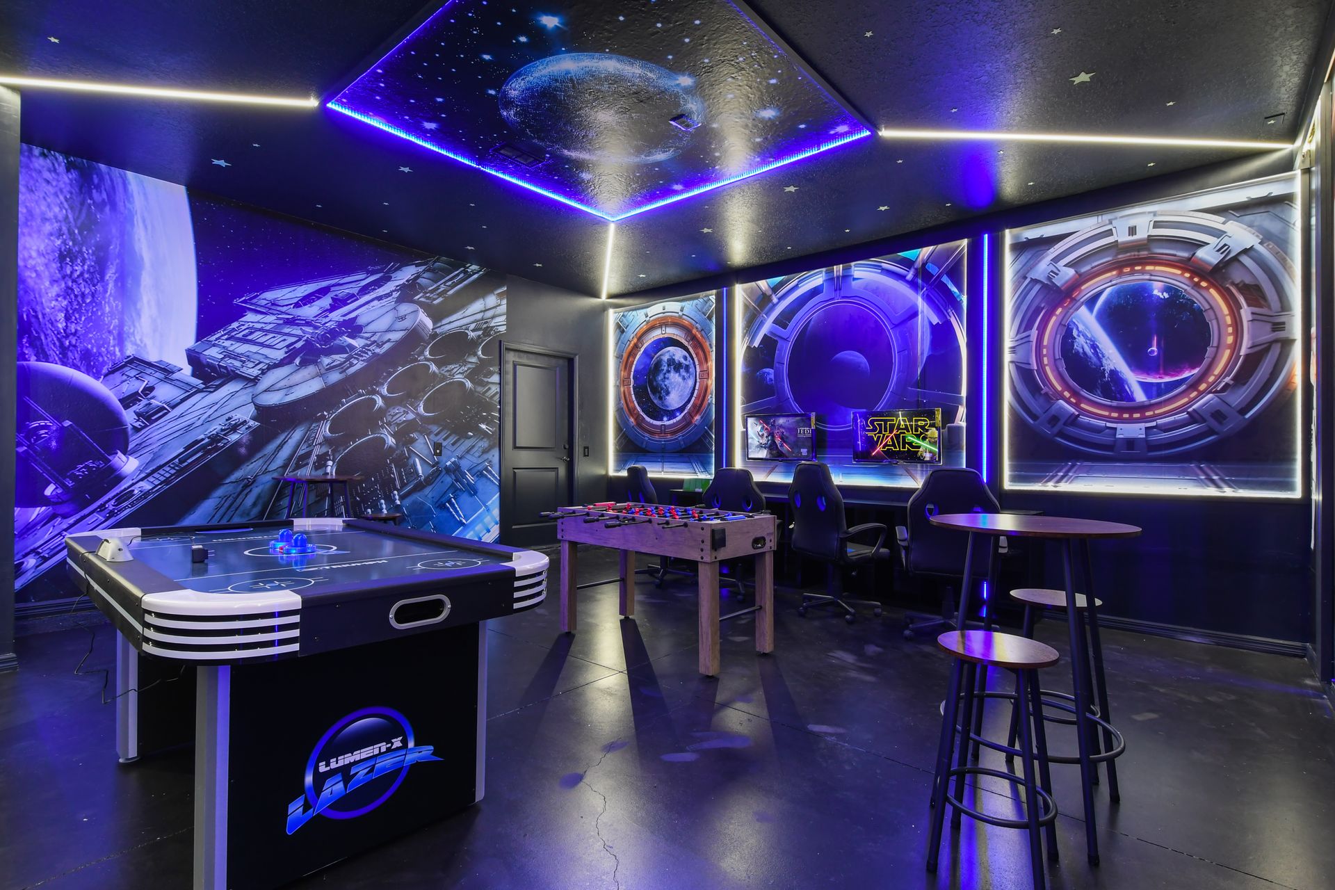 Immersive Star Wars game room with air hockey, gaming stations, and LED ambiance.