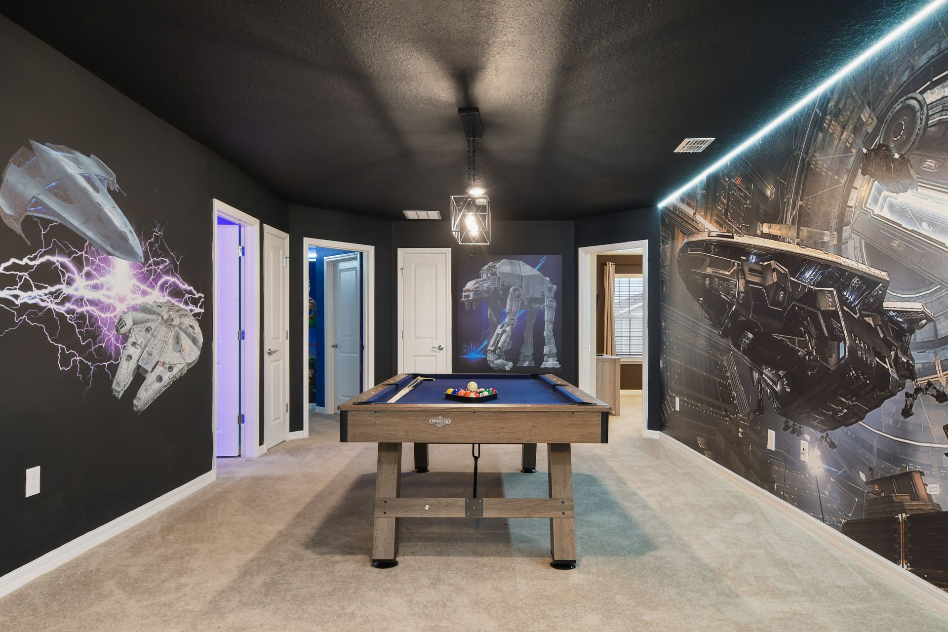 Space-themed billiards room featuring starship battles, mood lighting, and fun vibes.