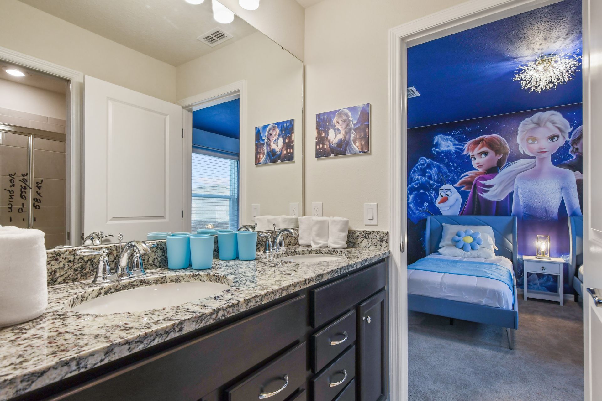 Frozen-themed twin room with en suite double-sink vanity and modern finishes.
