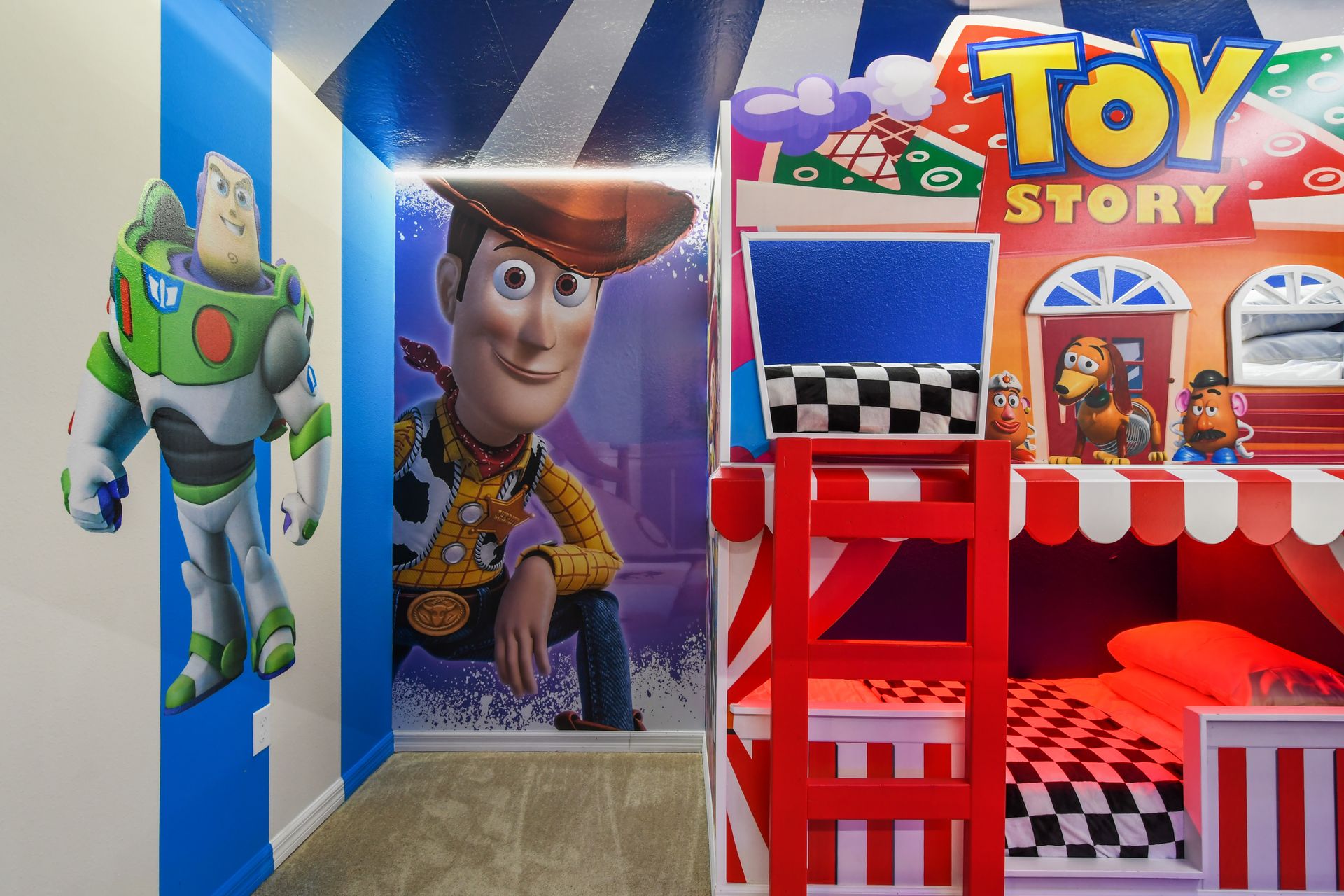 Toy Story bunk room with carnival flair, custom beds, and larger-than-life characters.