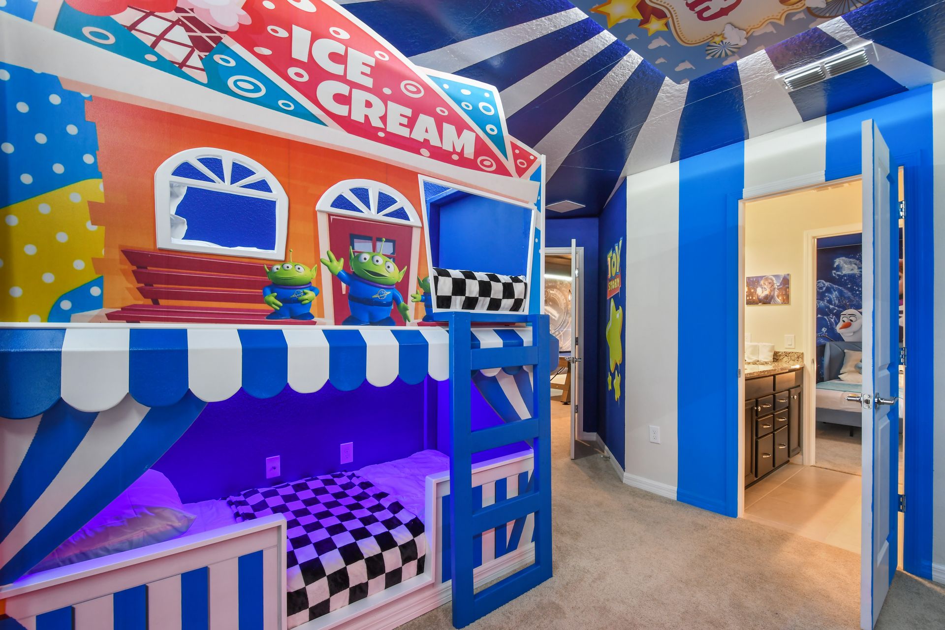 Colorful Toy Story bunk room with custom ice cream stand beds and playful murals.