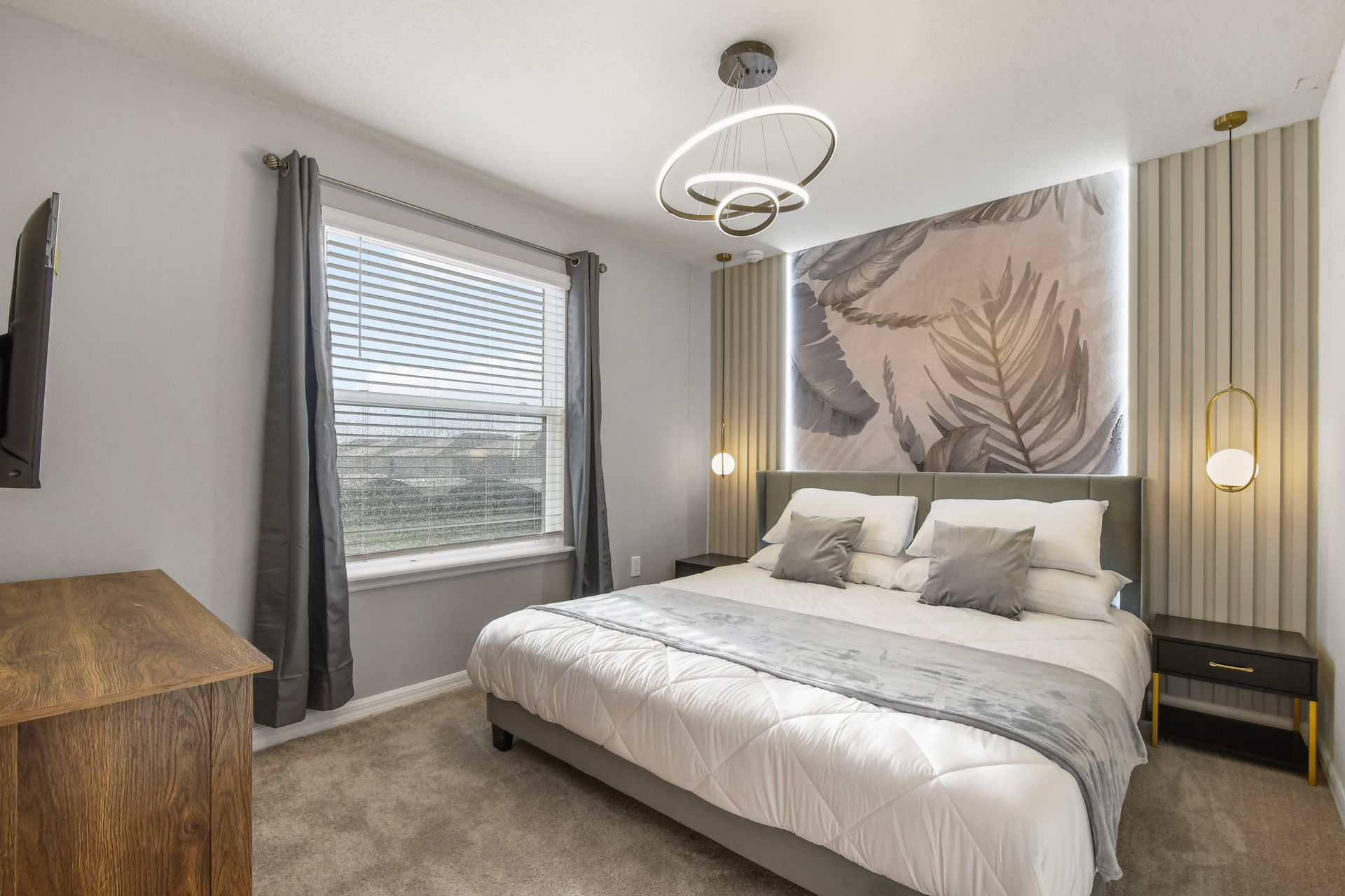 Modern king suite with calming neutrals, artistic flair, and natural light.