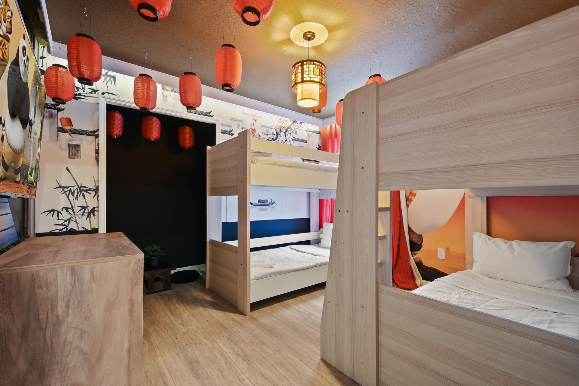 Kung Fu Panda themed bunk room with red lanterns, cozy beds, and playful murals
