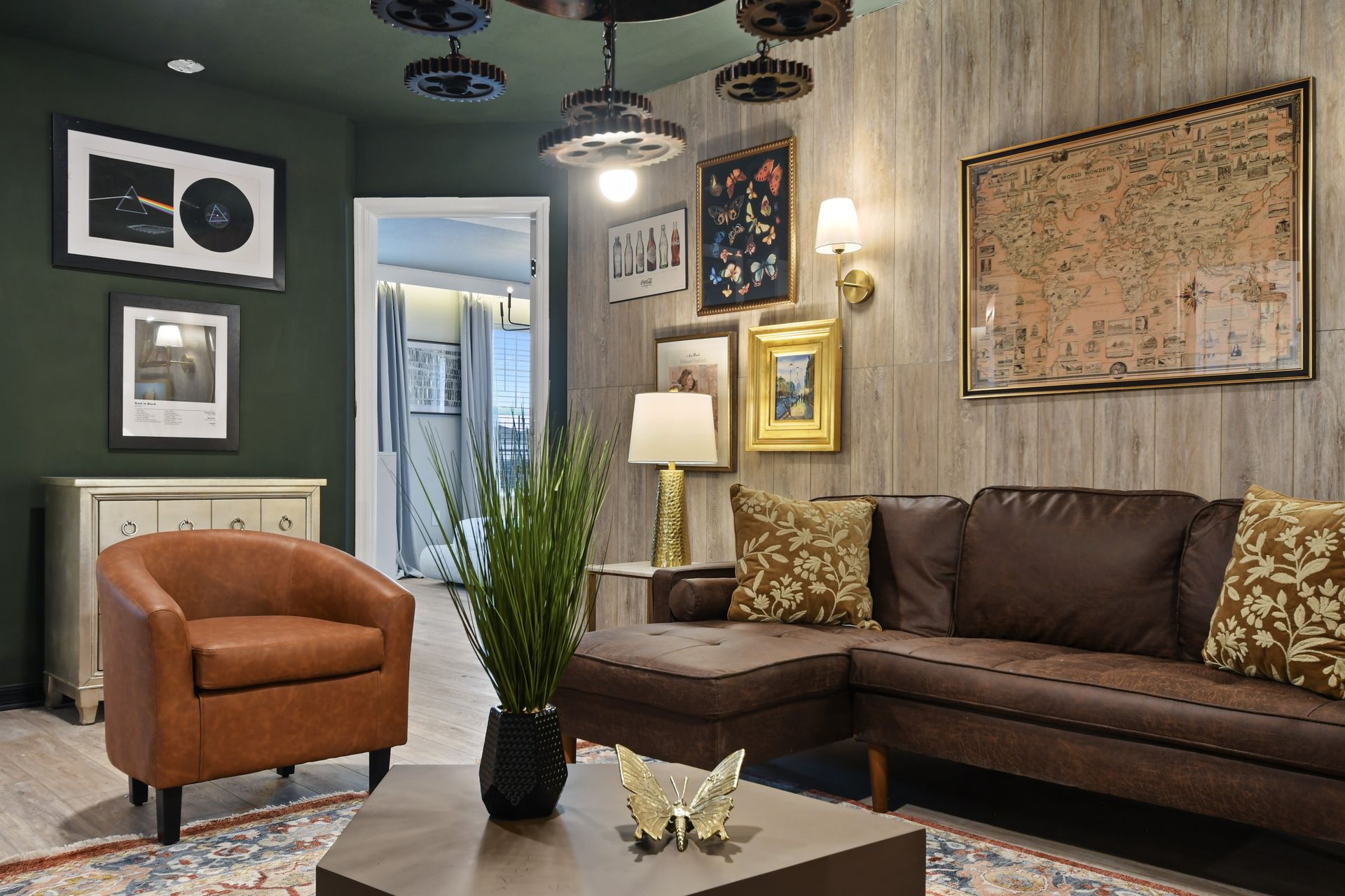 Cozy lounge with vintage art, leather seating, and warm tones for relaxing.