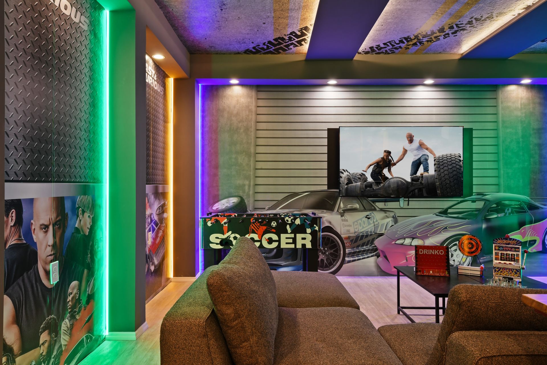 Fast & Furious themed lounge with neon lights, movie nights, foosball, and fun decor
