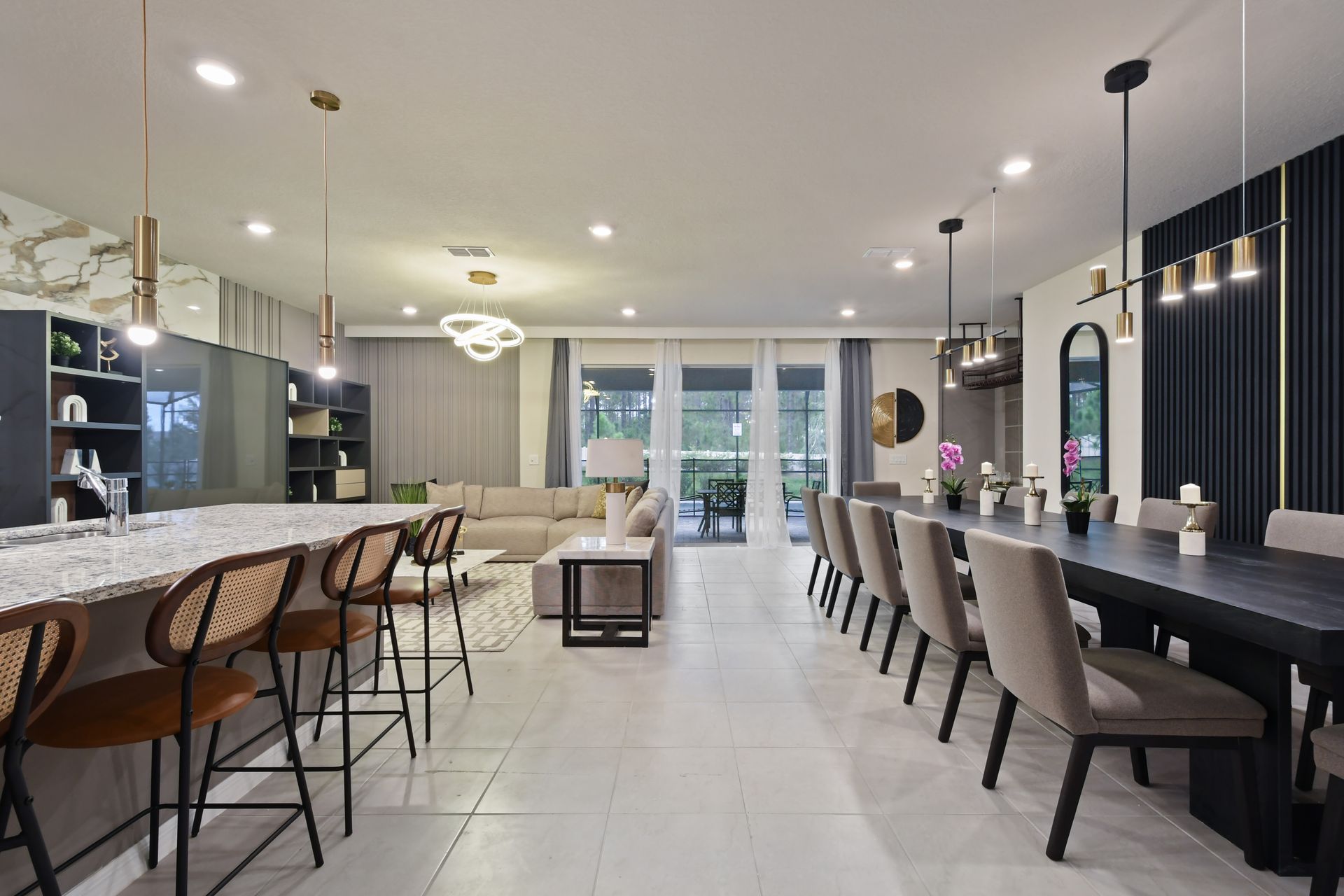 Modern kitchen with dark cabinets, granite countertops, and island seating for four.