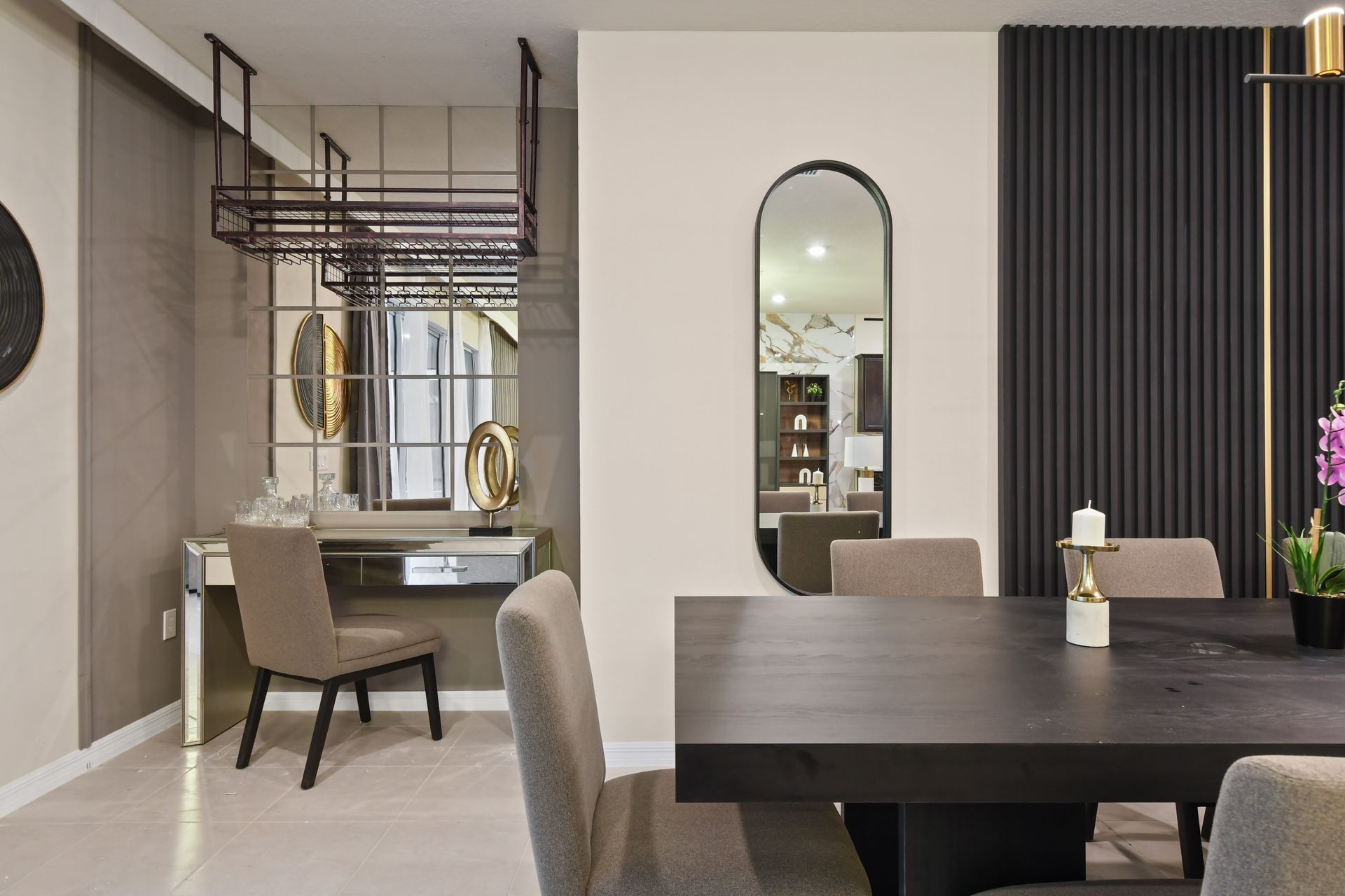 Spacious kitchen with dark cabinets, granite countertops, and modern appliances.