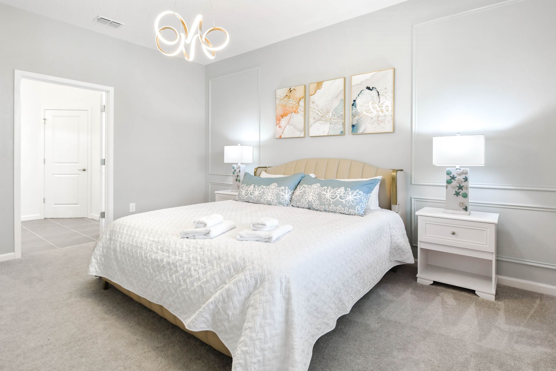 Elegant bedroom with coastal-inspired decor, soothing colors, and natural light.