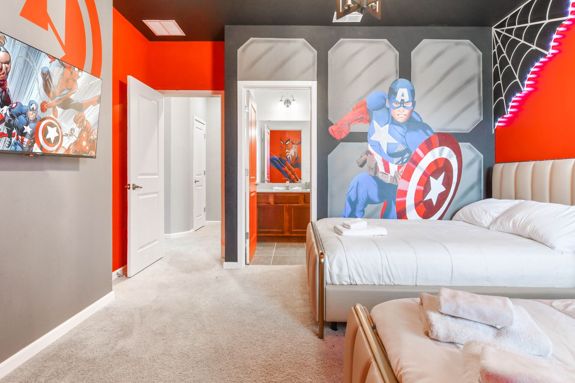 Enjoy a peaceful night's sleep in our charming Captain America inspired bedroom, offering you comfort and tranquility.
