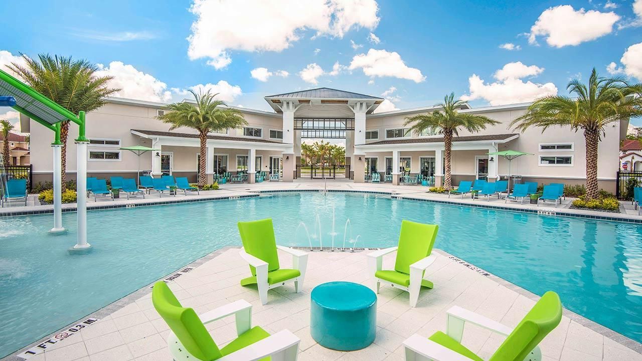 Resort-style escape with a stunning pool, splash zone, and luxury lounge seating