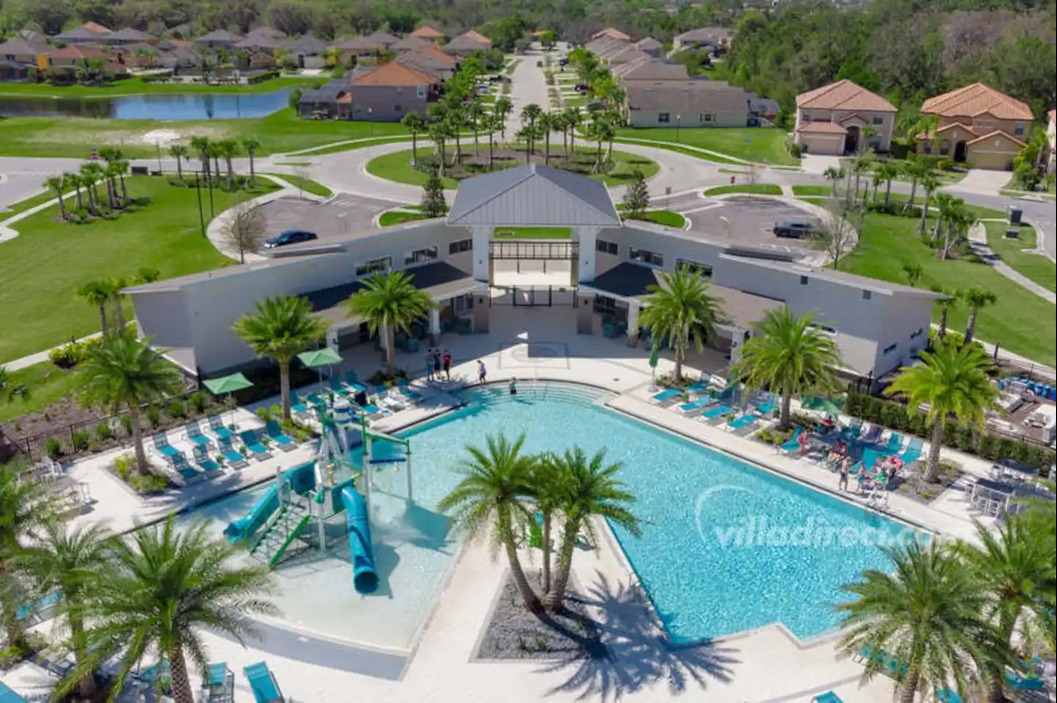 Resort-style retreat with a stunning pool, lush palms, and modern luxury!